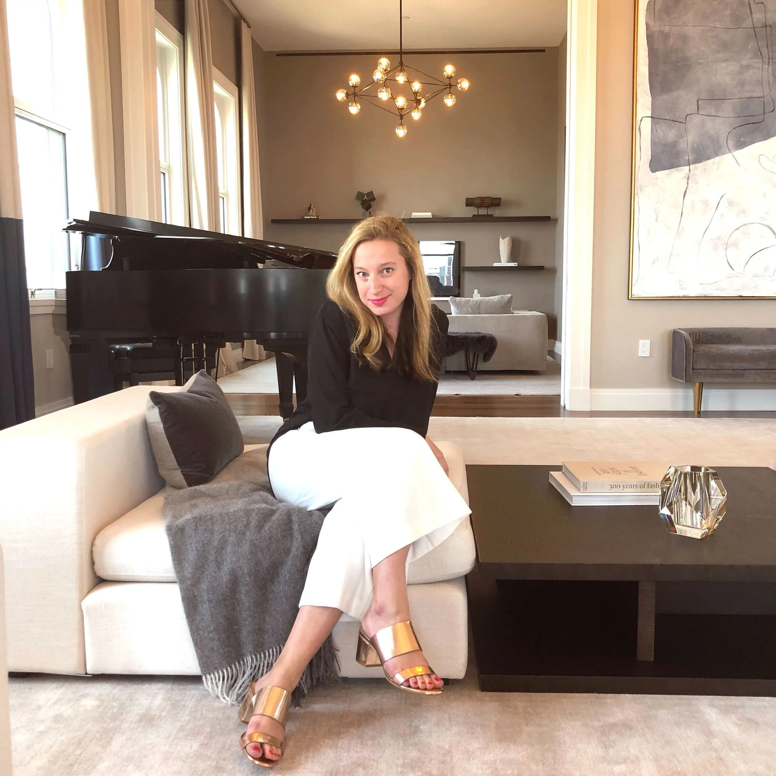 Taylor sitting at one of her clients listings in Lower Manhattan.