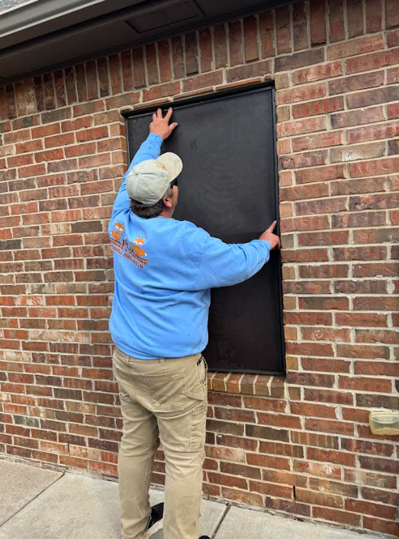 dad putting up a screen .png