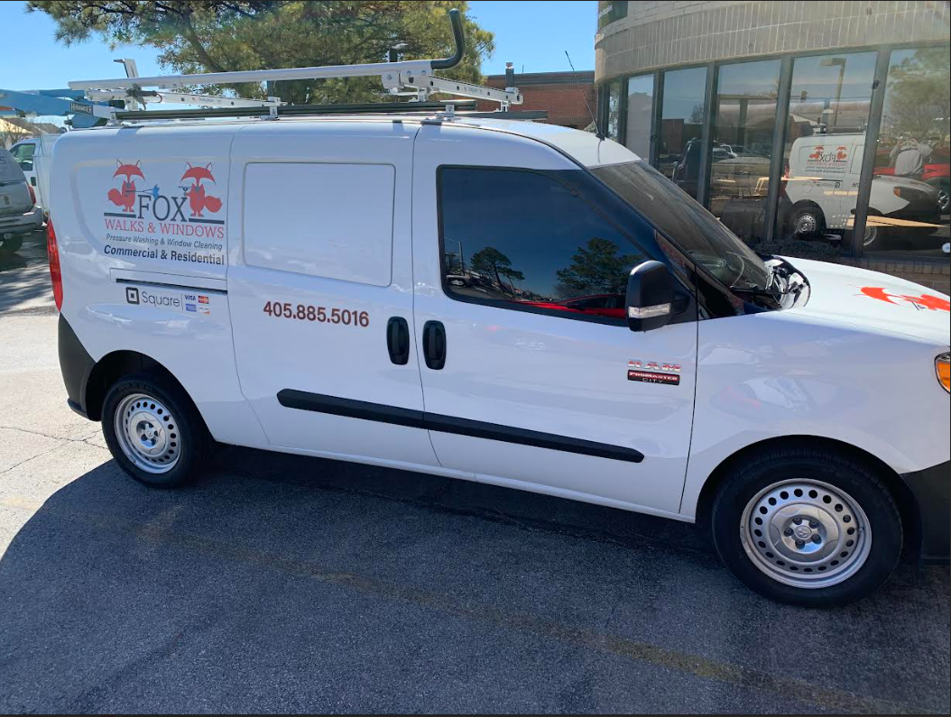 White service van with logos and contact information for Fox Walks and Windows
