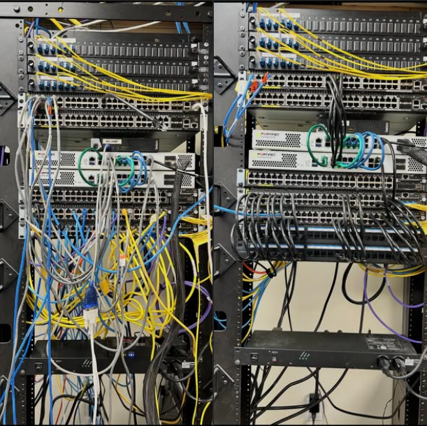 Two server racks filled with network switches, routers, and cable management with various colored Ethernet cables.