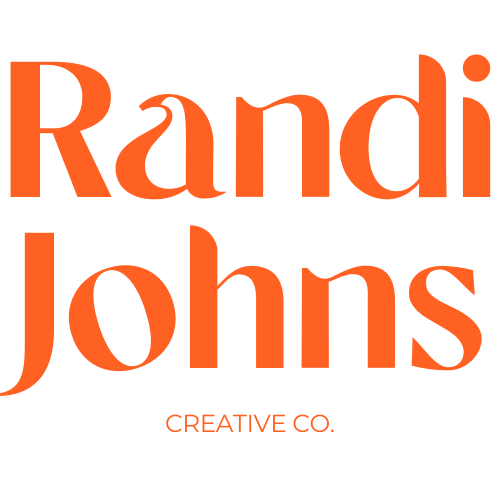 Logo with the words "Randi Johns" in large orange text and "CREATIVE CO." in smaller orange text below.