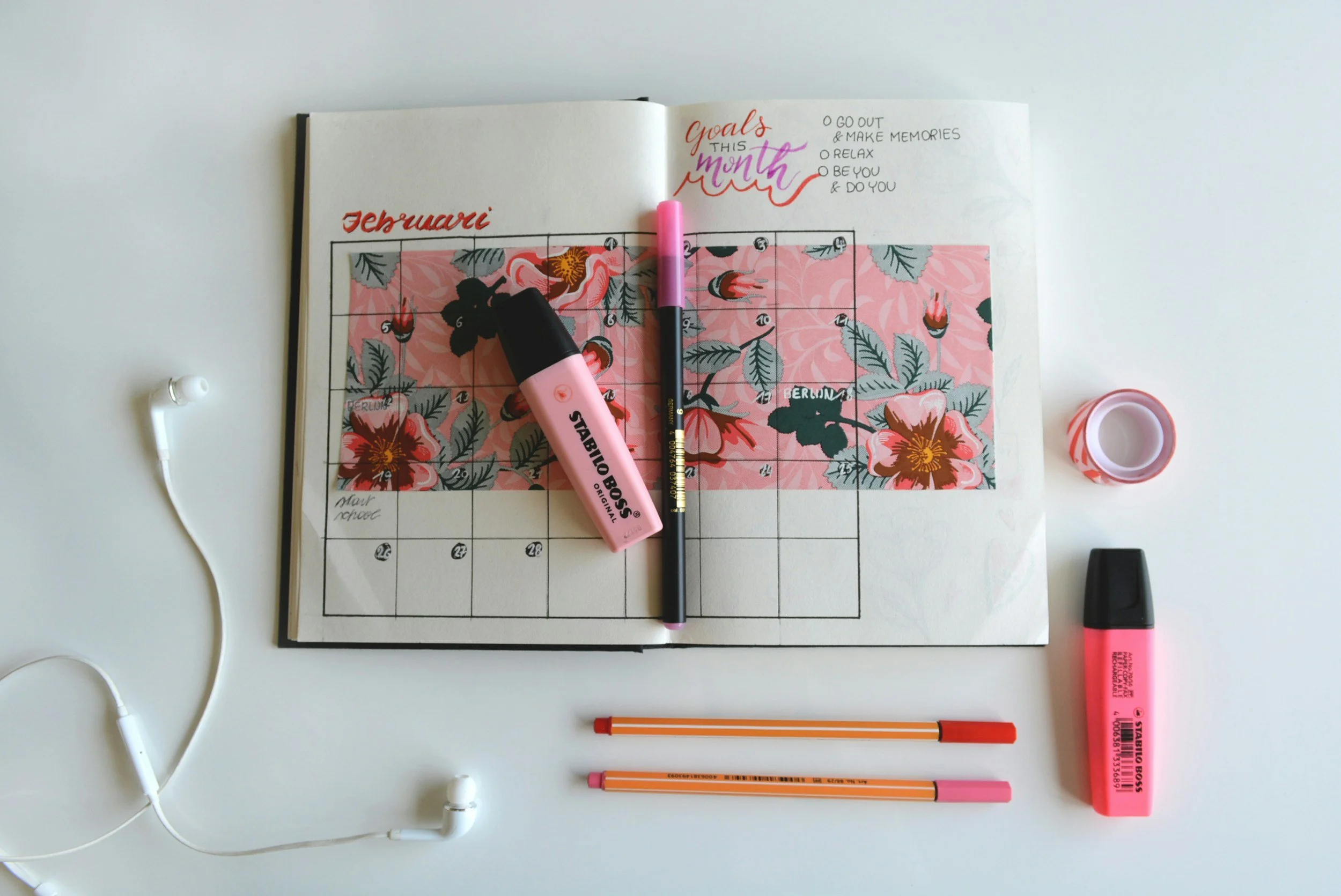 pretty calendar journal on a desk with girly and pink aesthetics