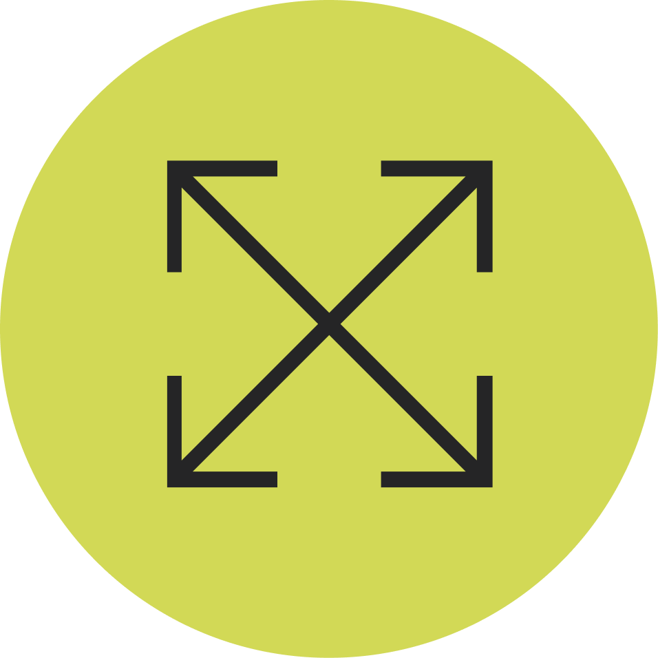 A yellow-green circular button with black arrows pointing outward in the four diagonal directions.