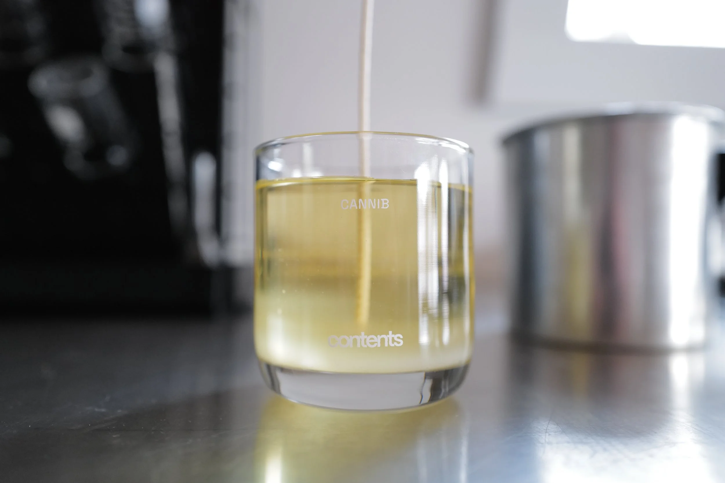 CANNIB CANDLE MAKING.JPG