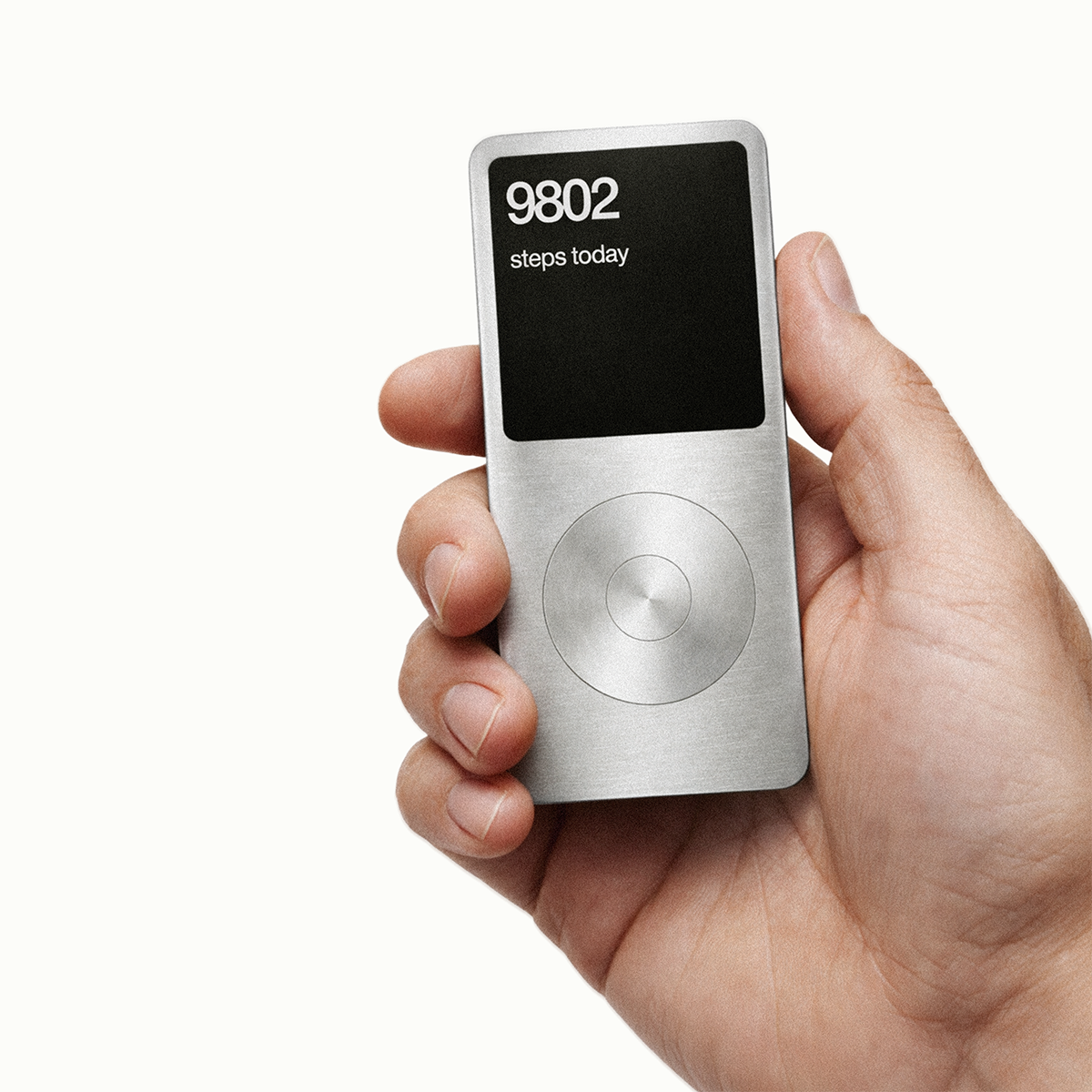 A person holding a silver iPod Classic with a screen displaying '9802 steps today' in black background.