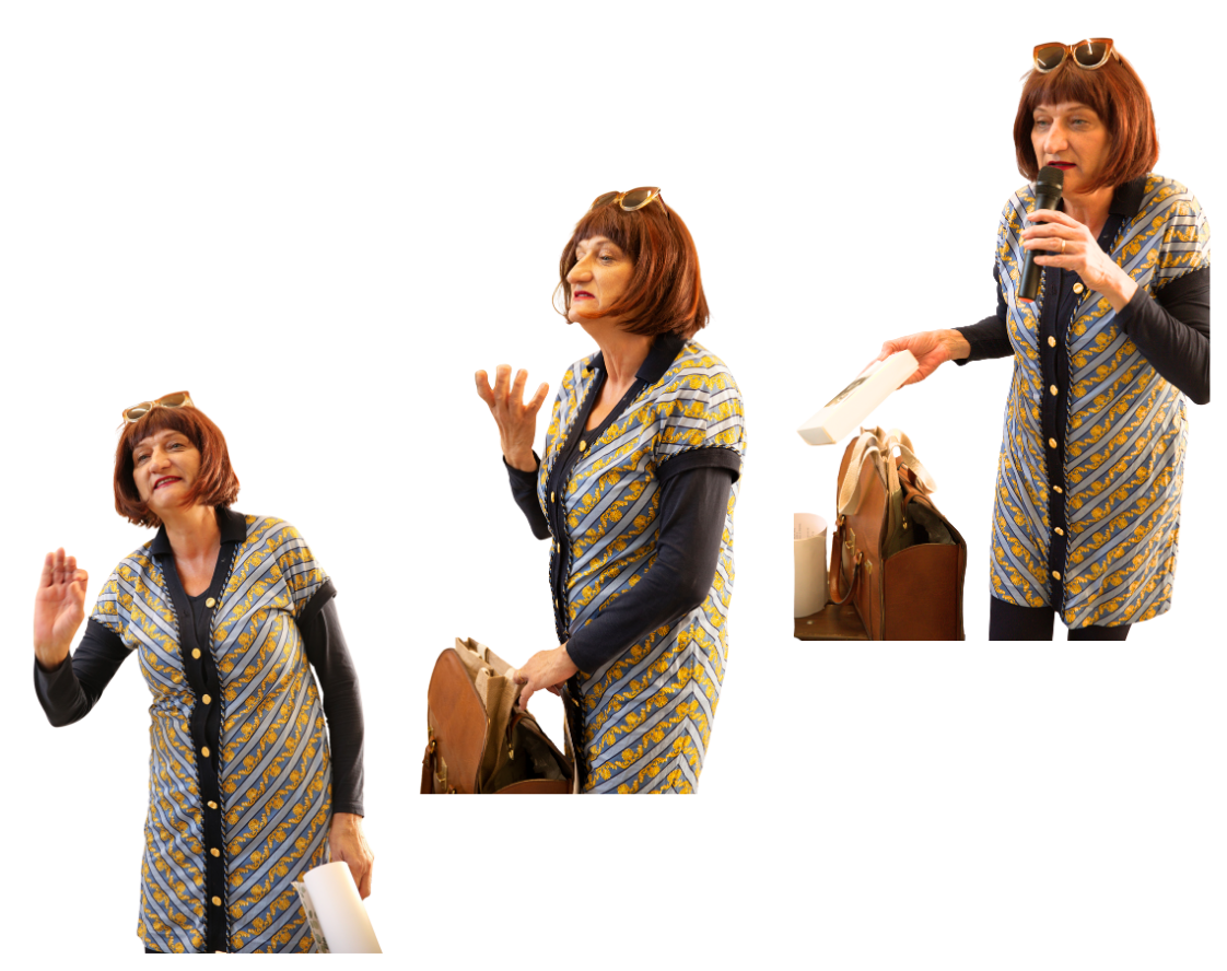 A woman with red hair in a patterned dress holding a microphone and a book on stage, speaking to an audience, with various gestures and expressions.