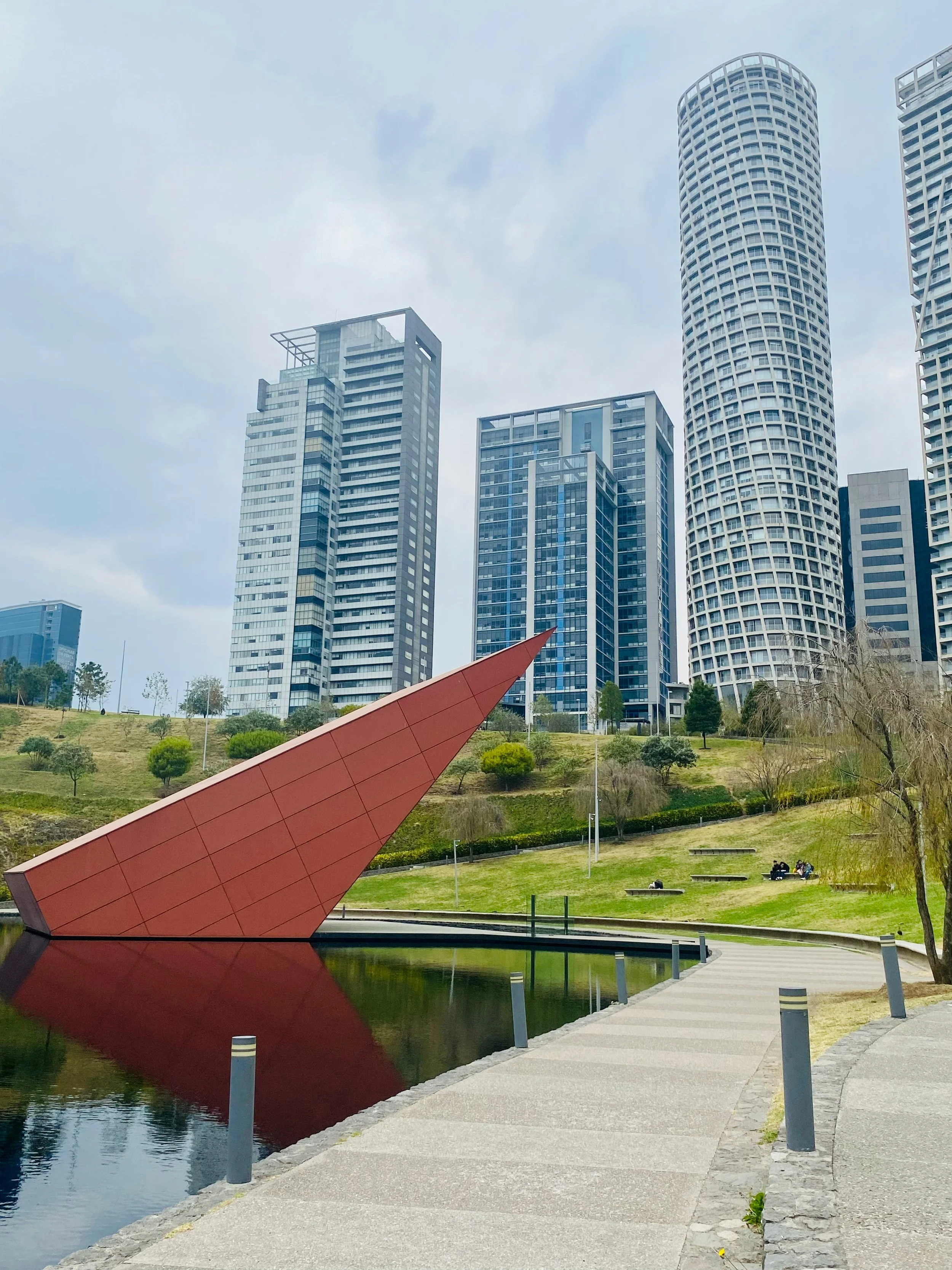 Fountain and Water in Mexico City in a Park with Skylines in the background
