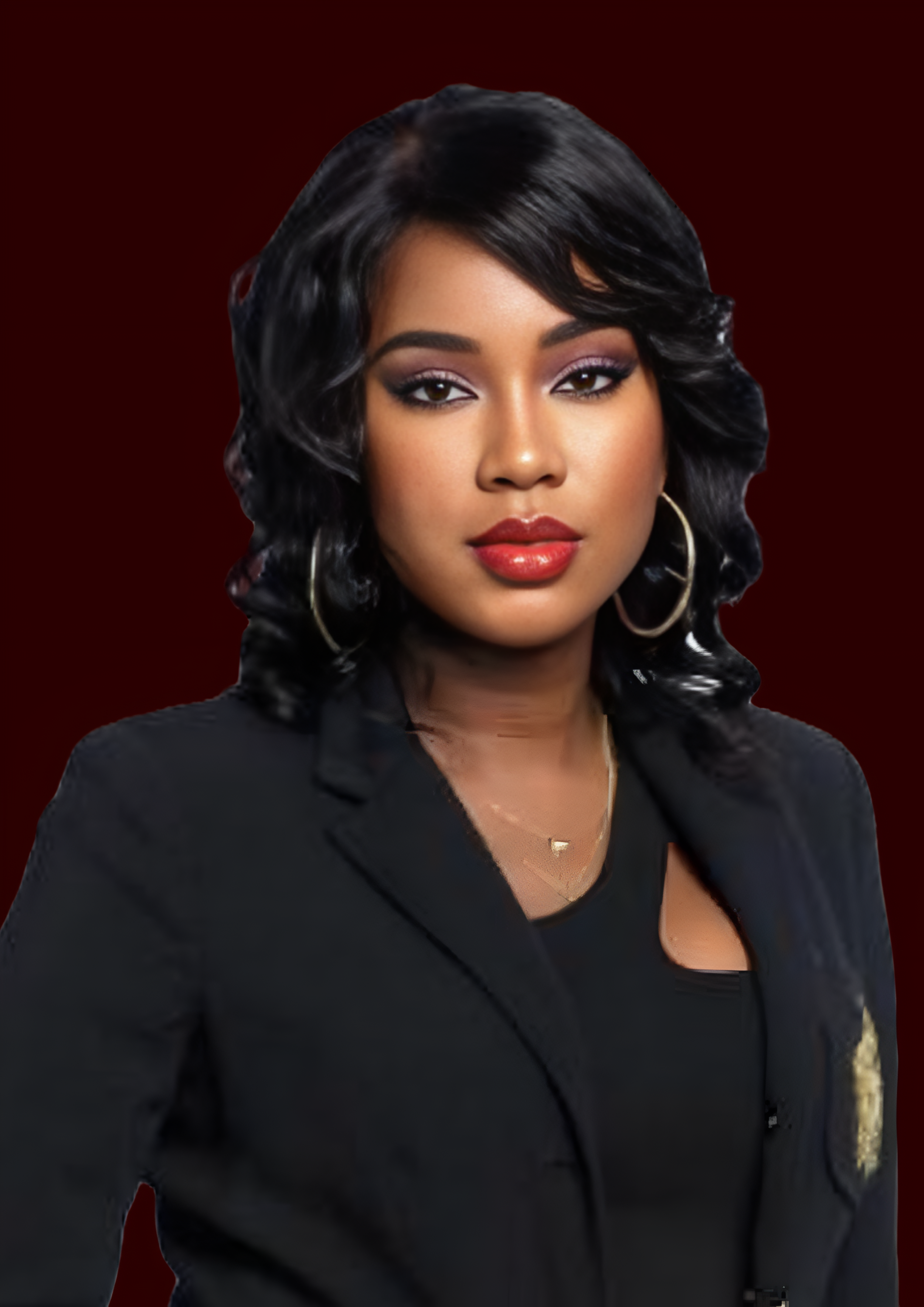 Portrait of a woman with black, wavy hair, red lipstick, and gold hoop earrings, wearing a black blazer and black top, against a dark red background.
