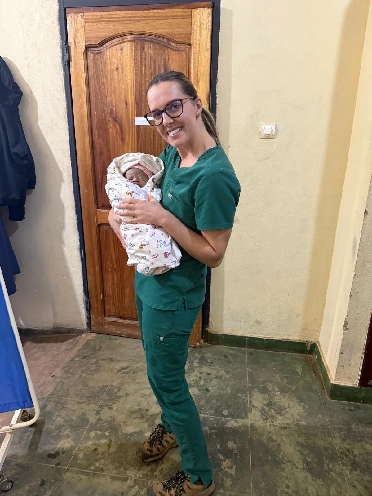 megan holding baby at clinic.JPG
