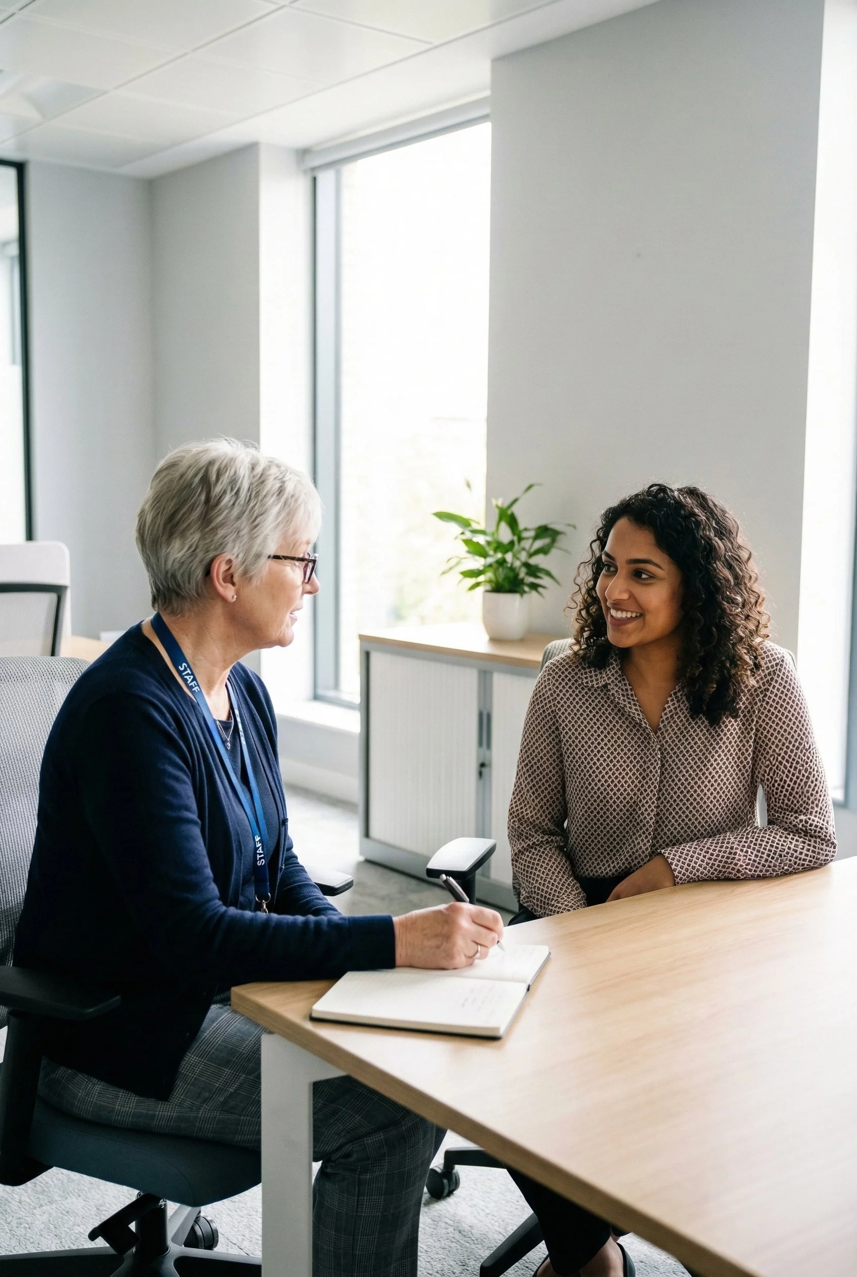 Social worker meeting with a recruitment consultant to discuss a permanent role in a UK office