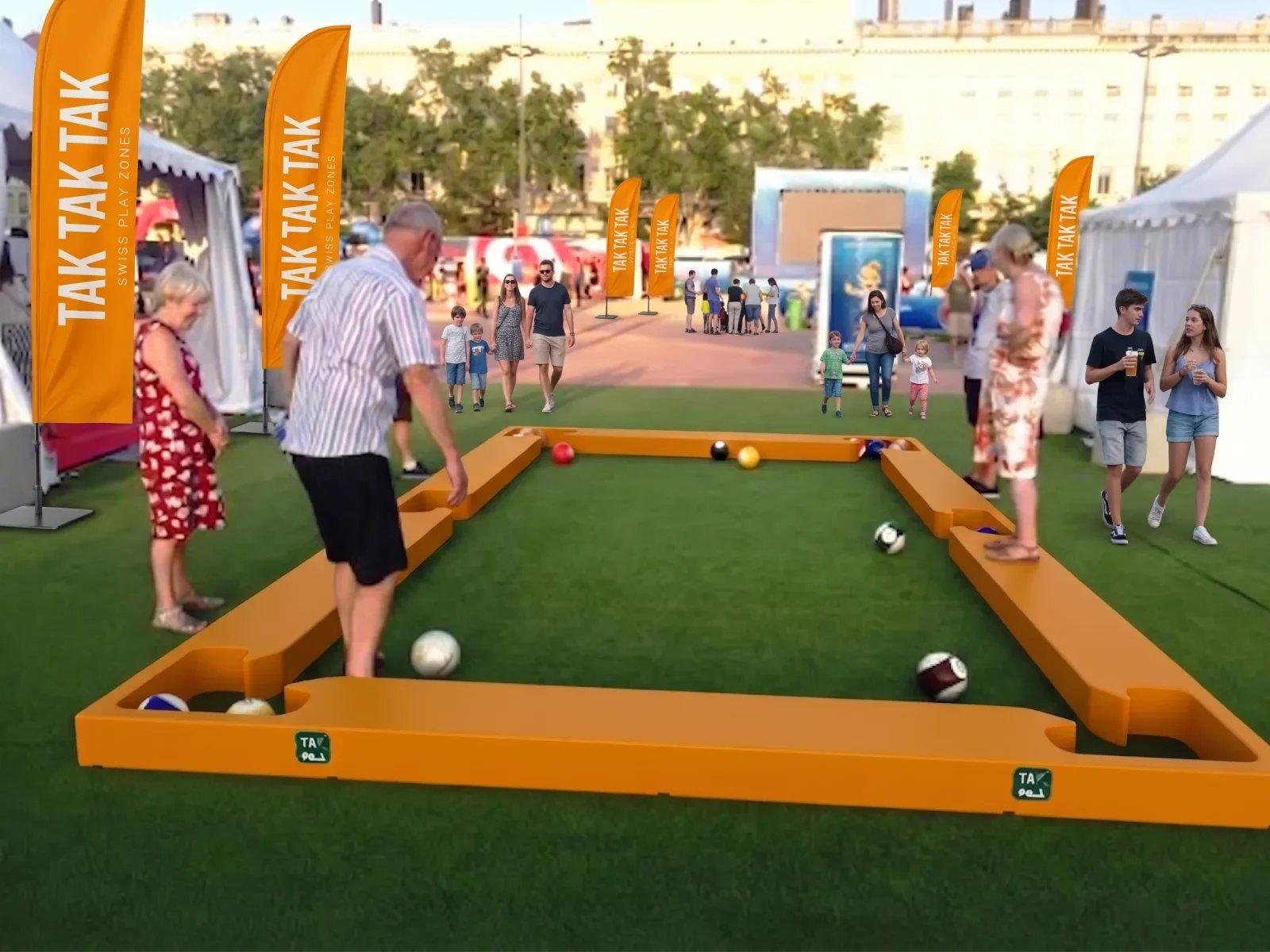 Participants plus âgés jouant au Football Billard dans une zone d’activités