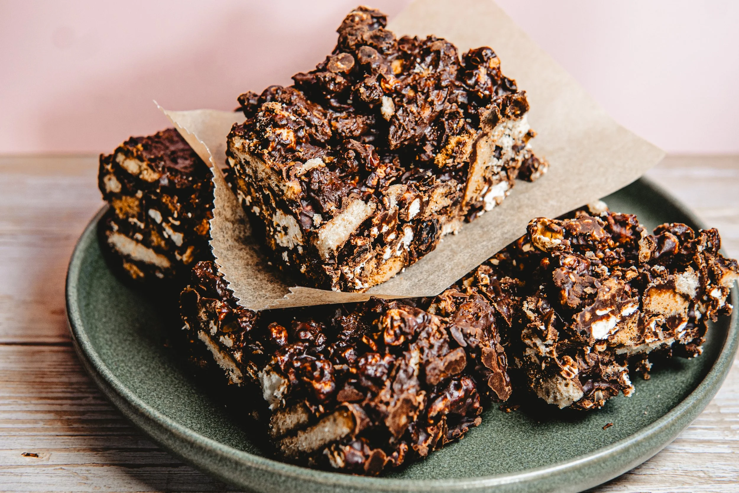 Chocolate rice crispy treats on a green plate