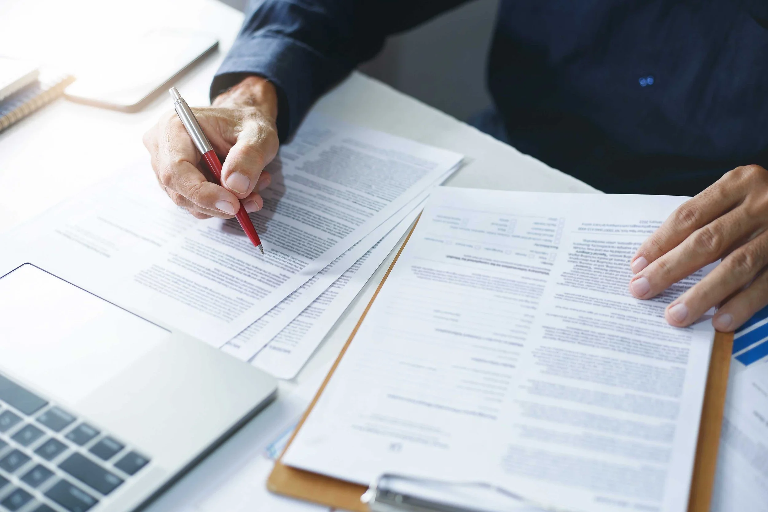 Legal expert, professional lawyer reading and checking financial documents or insurance contracts.