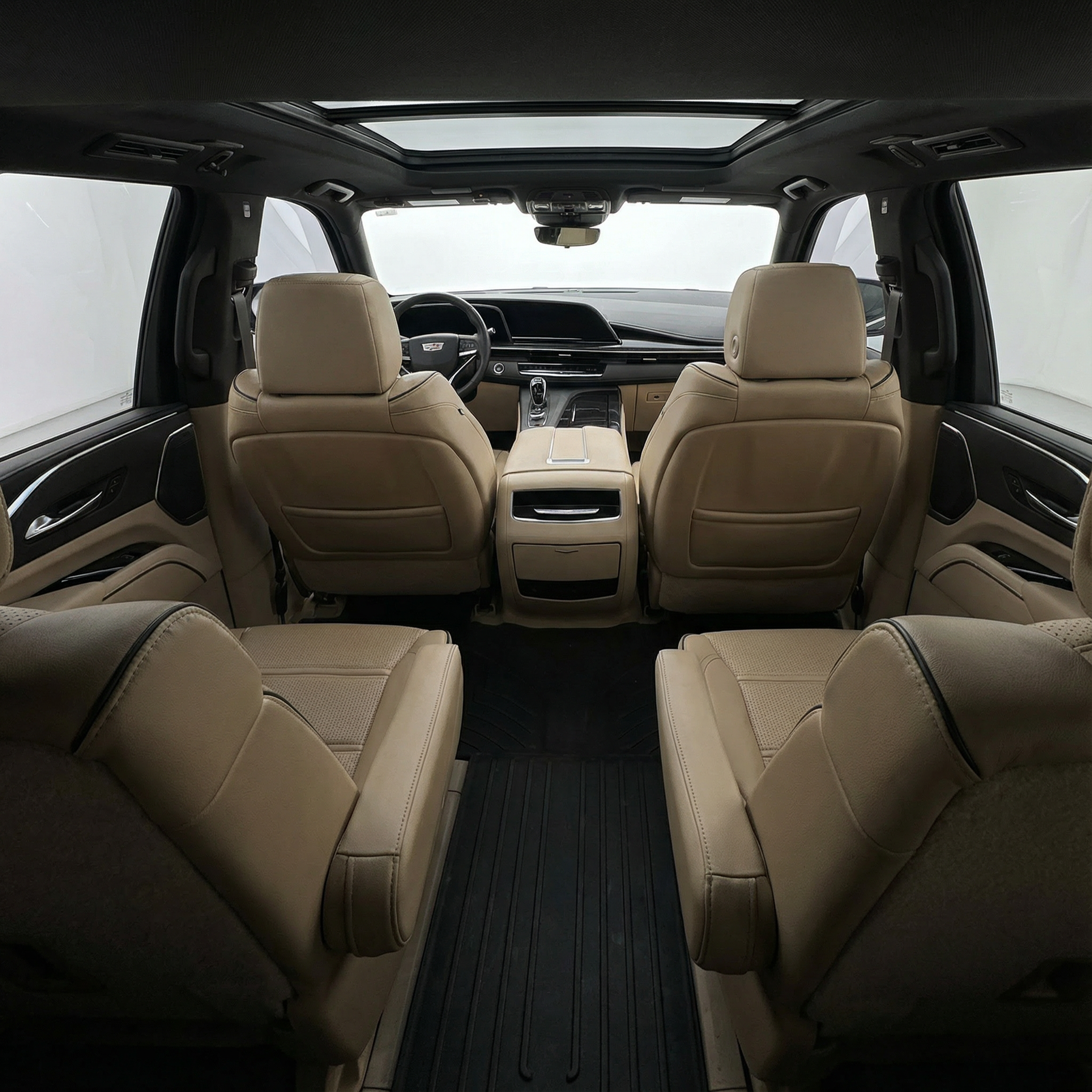 Interior view from the back seat of a 2022 white Cadillac Escalade