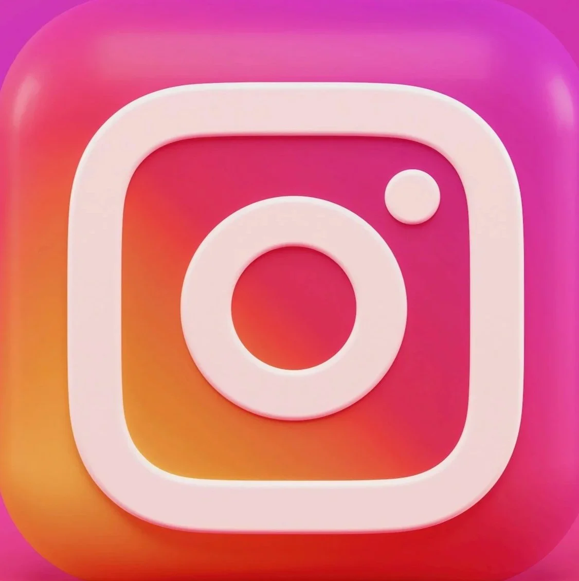 Close-up of the Instagram app logo with a pink, orange, purple gradient background.