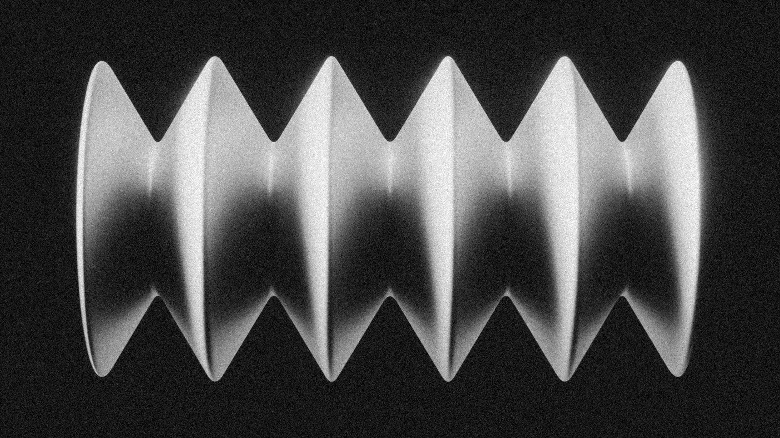 Black and white image of a grooved, spiral-shaped object.