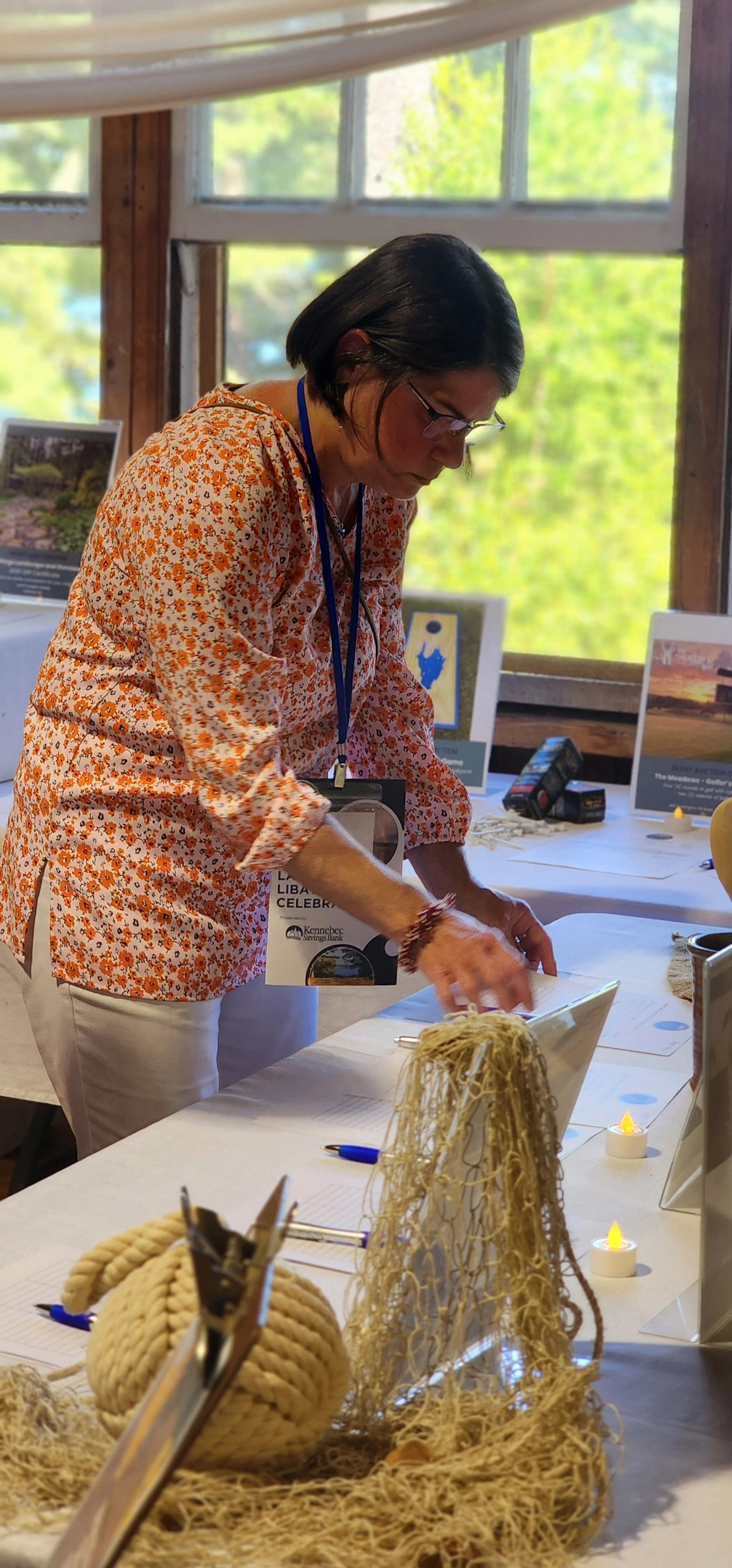 A woman in the silent auction area