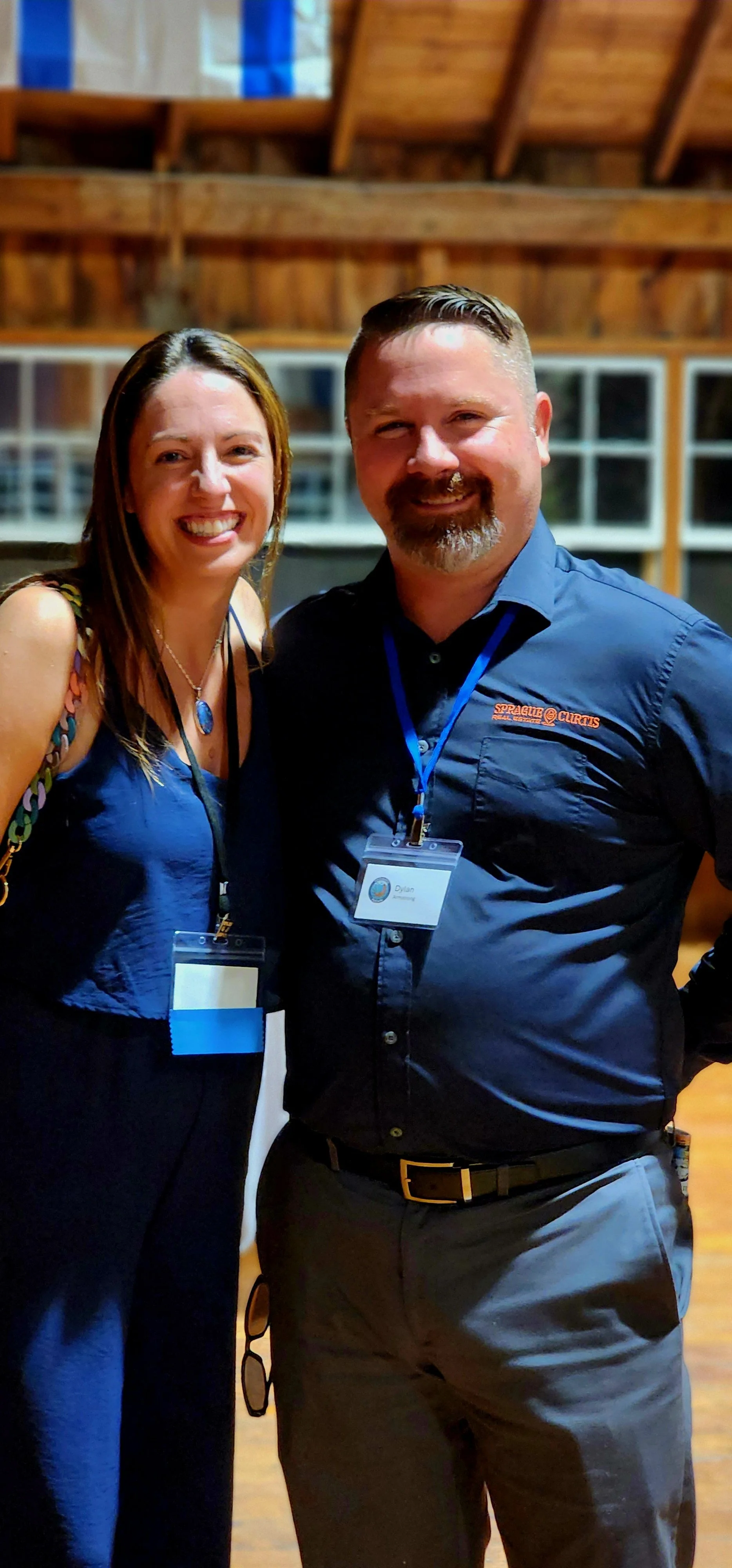 A woman and a man smiling at the camera