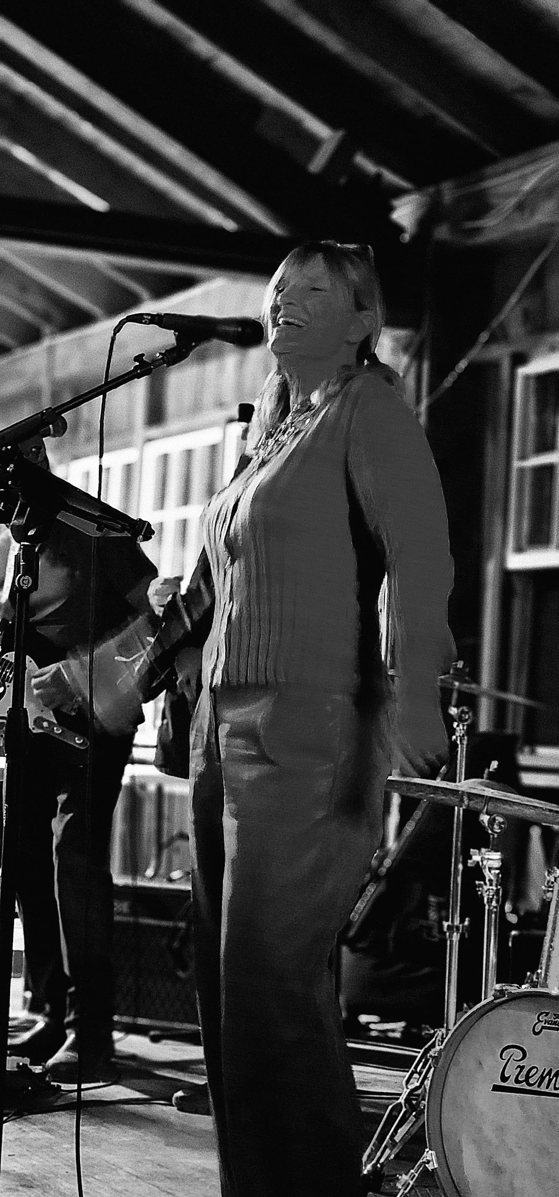 A woman singing into a microphone