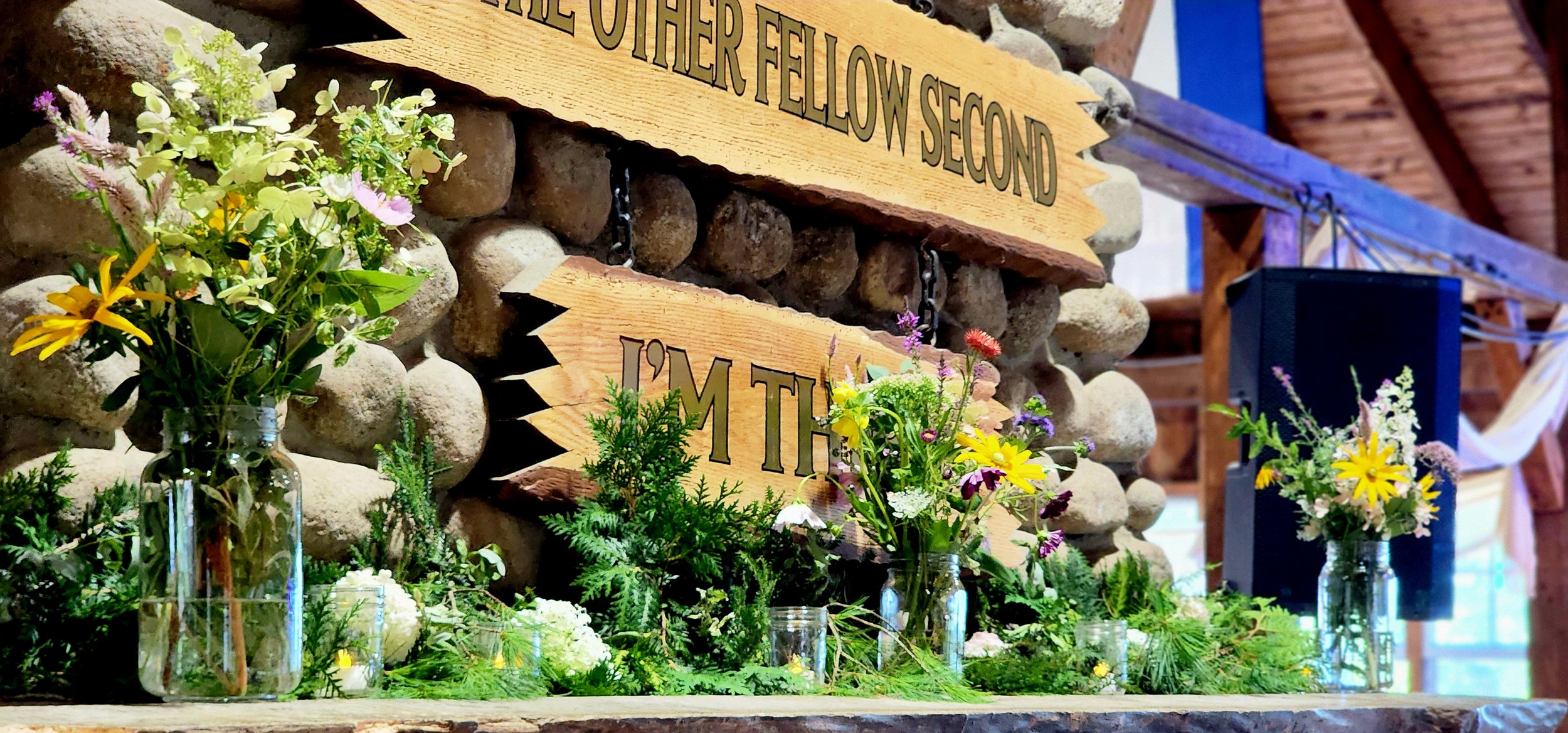 Fireplace mantle with greenery on it