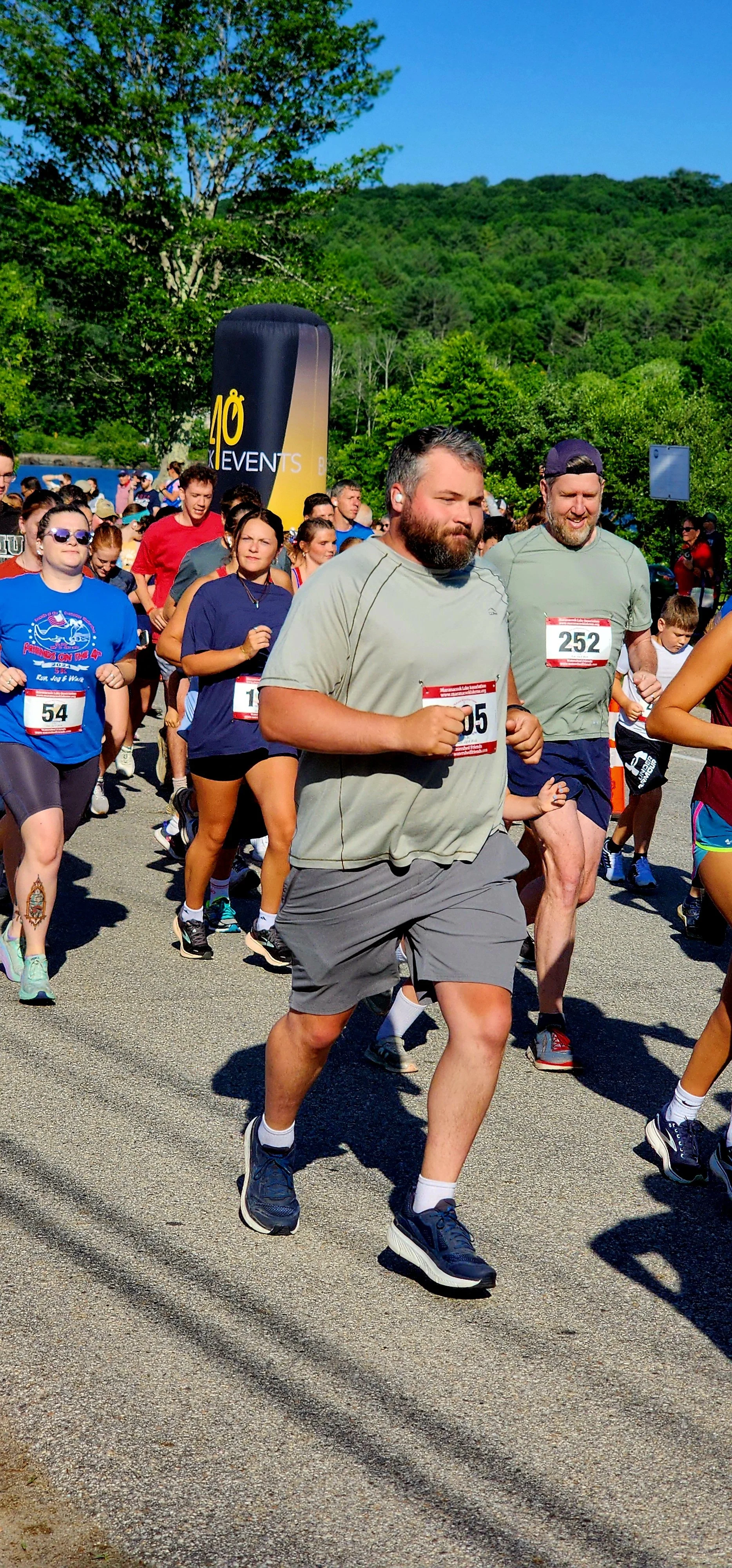 A crowd of people running