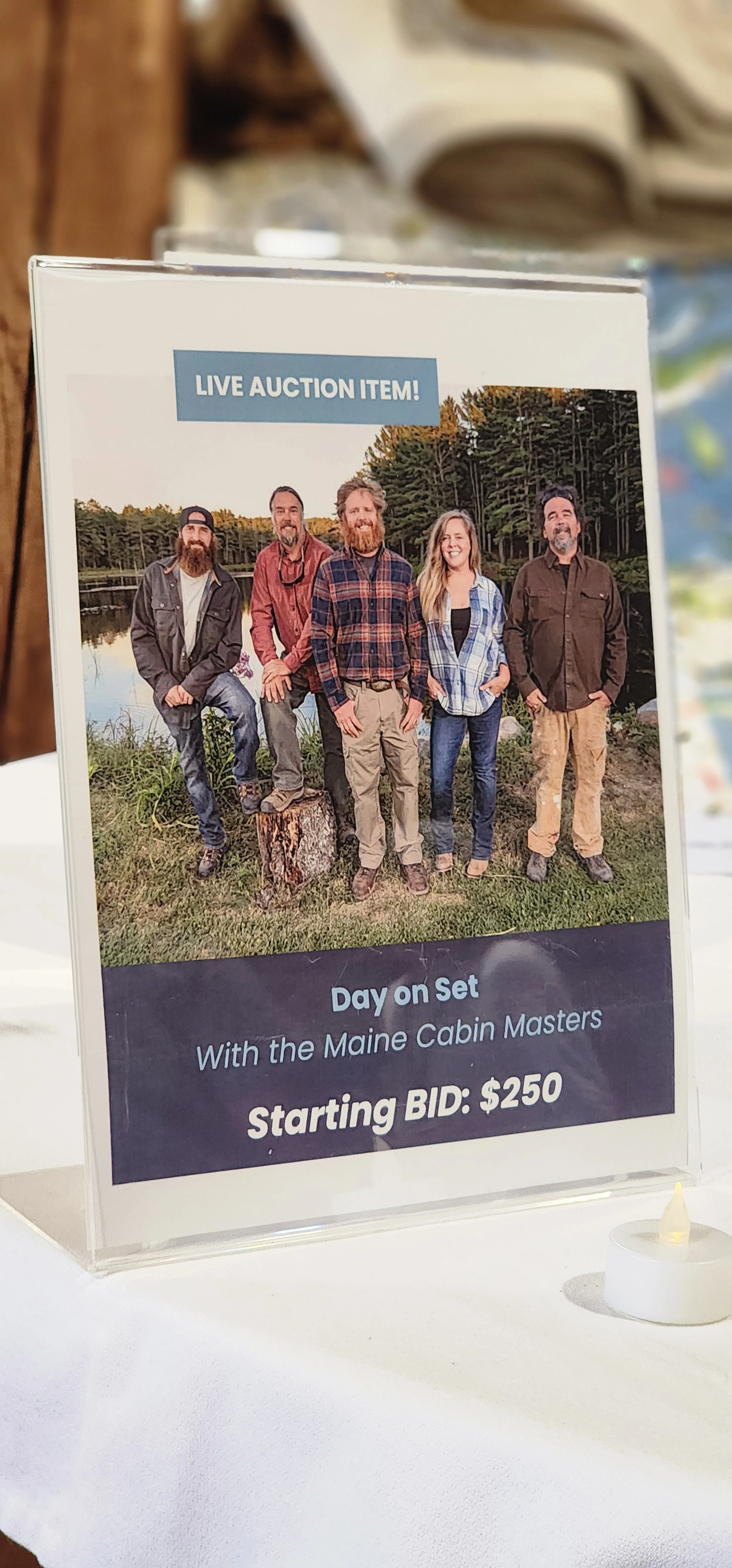 Live auction item for a day on set with the Maine Cabin Masters