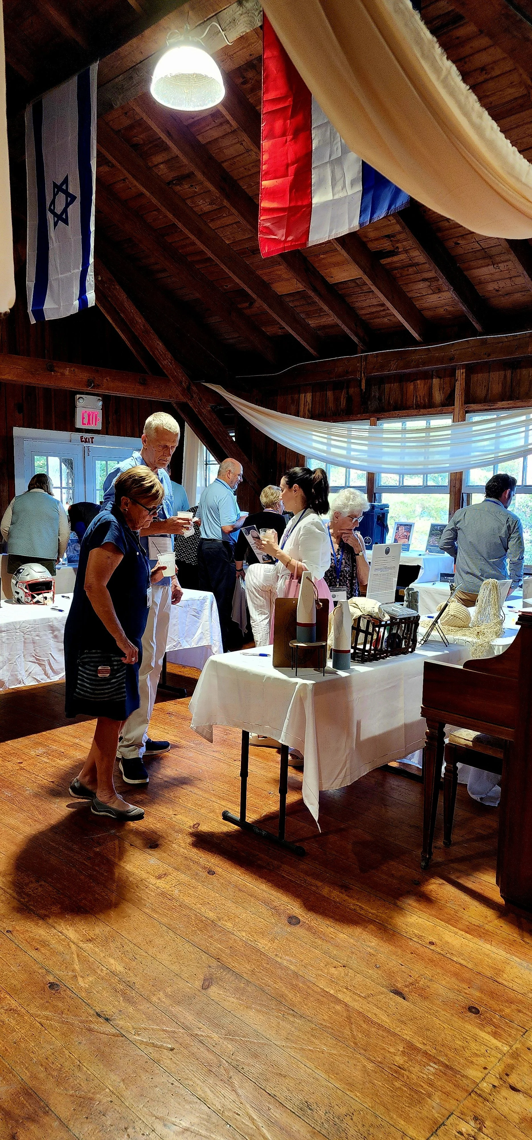 People perusing the silent auction items