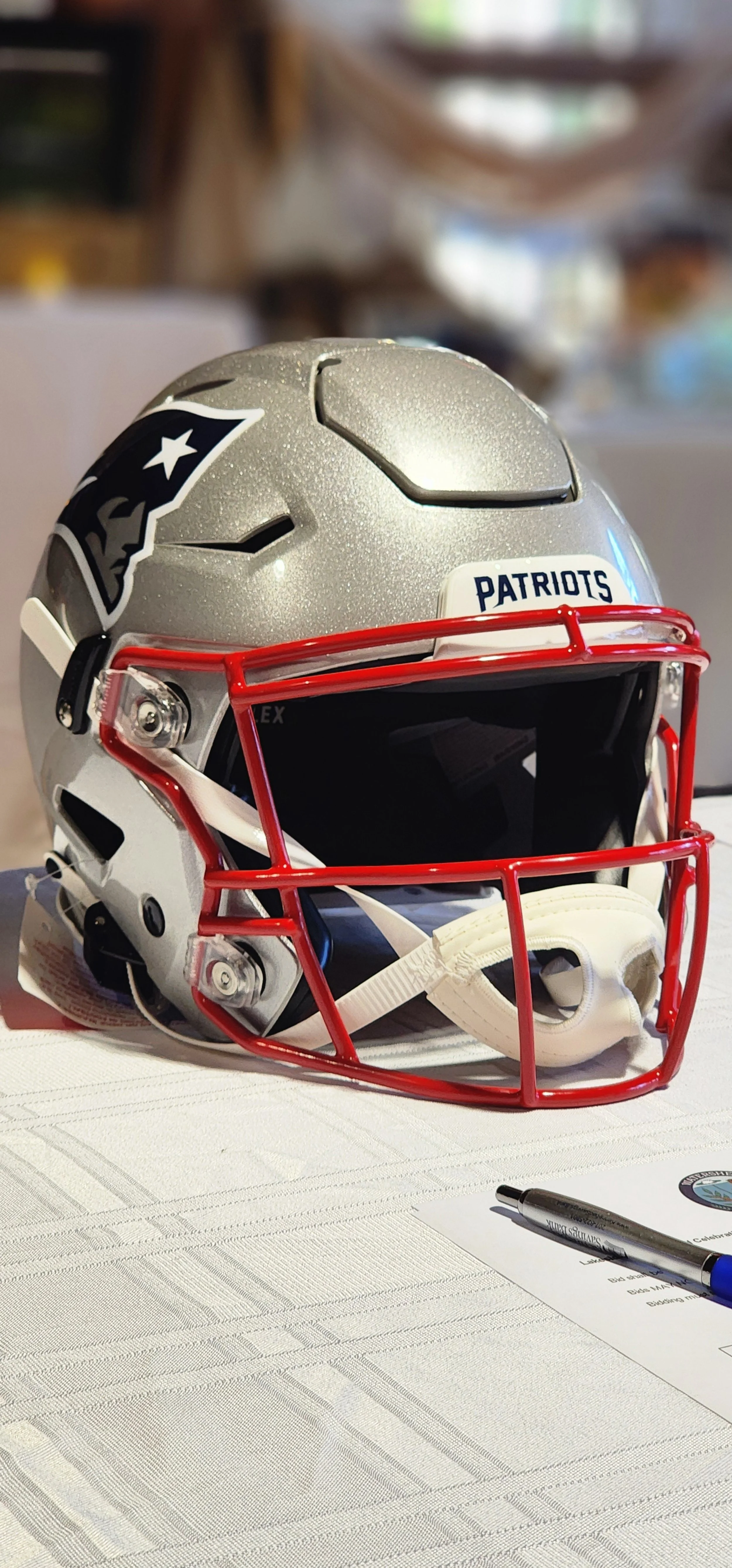 A silver New England Patriots decorative helmet