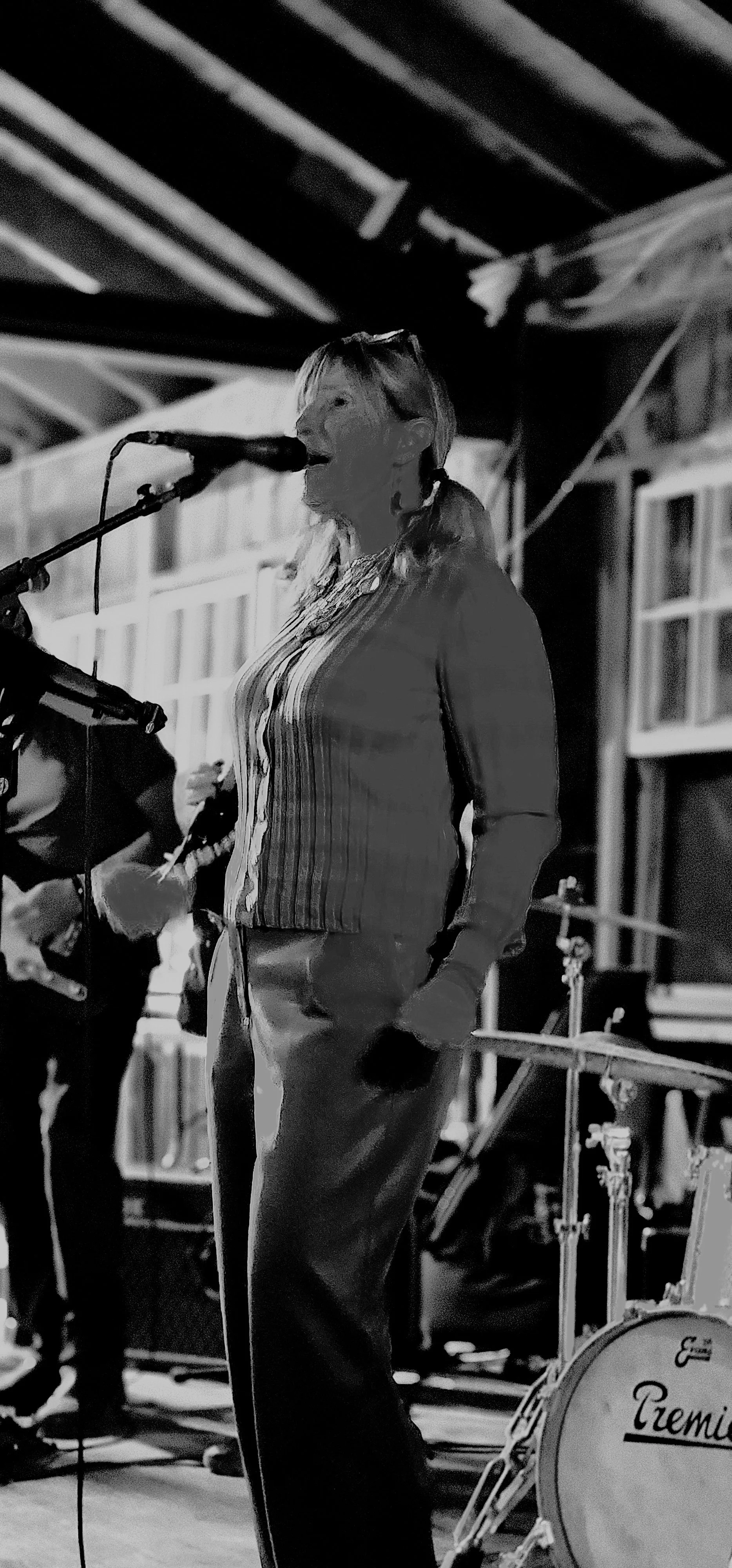 A woman singing into a microphone