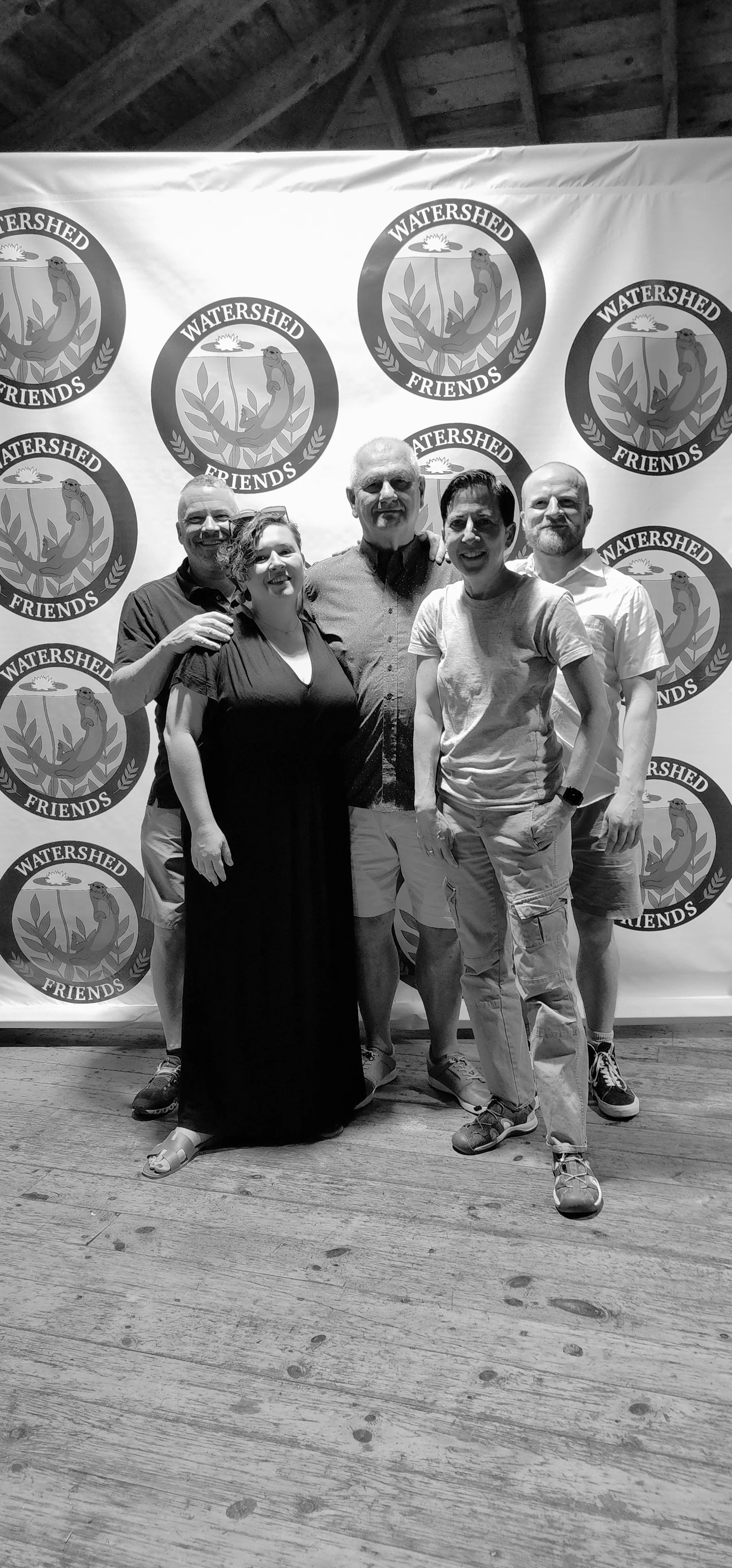 Five people smiling at the camera