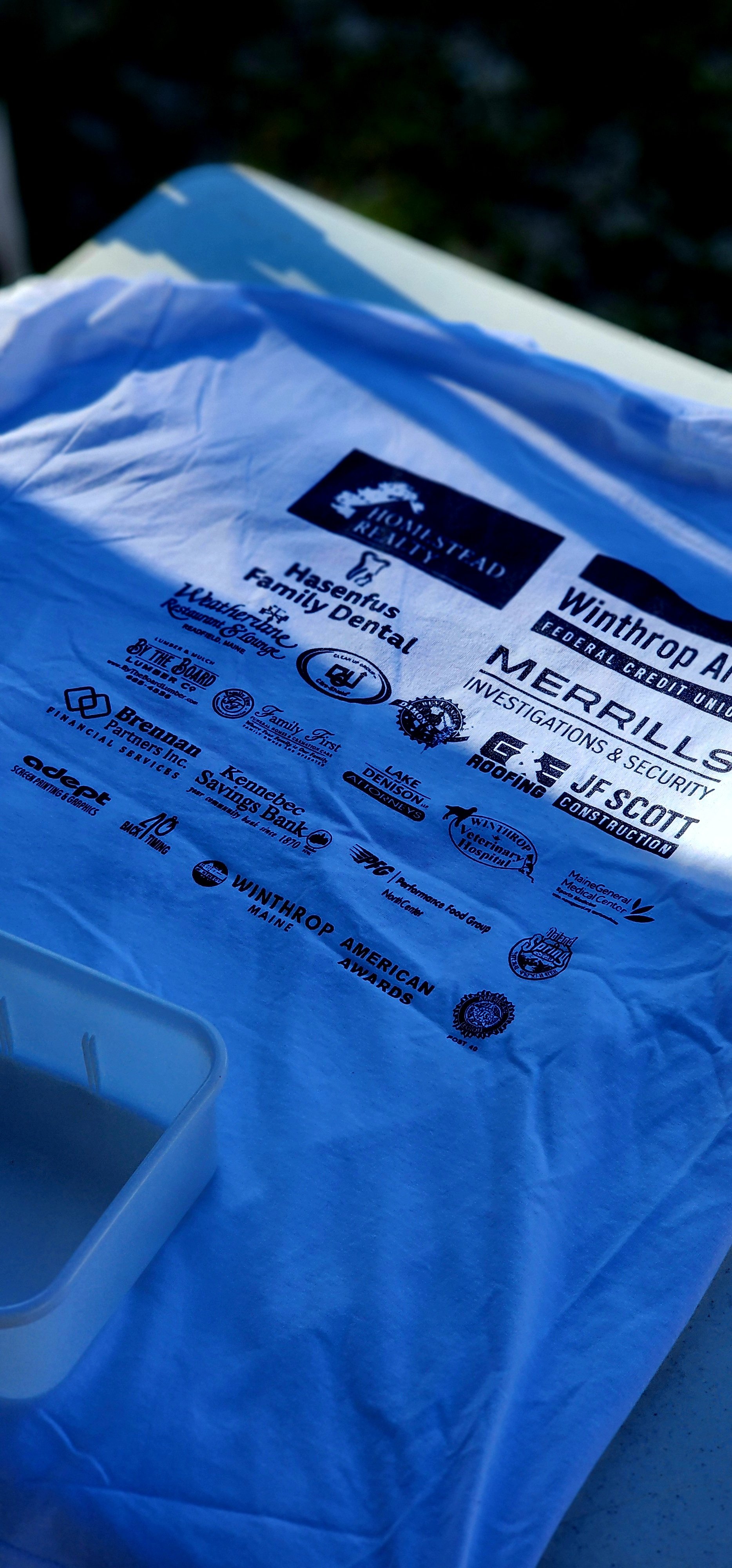 The back of a race t-shirt, showing all of the sponsor logos