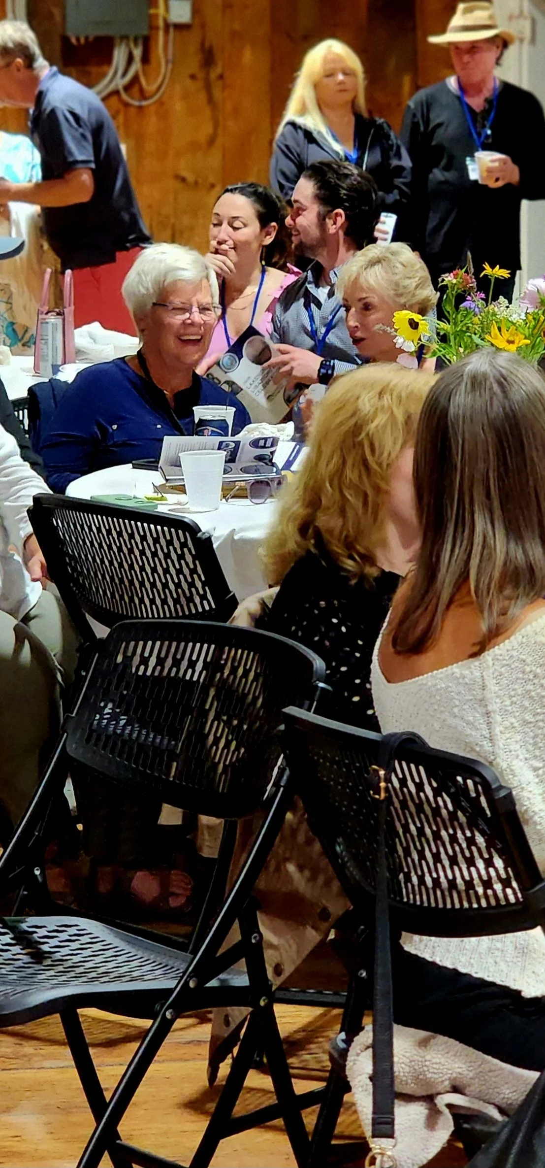 A distant shot of people sitting at a table talking