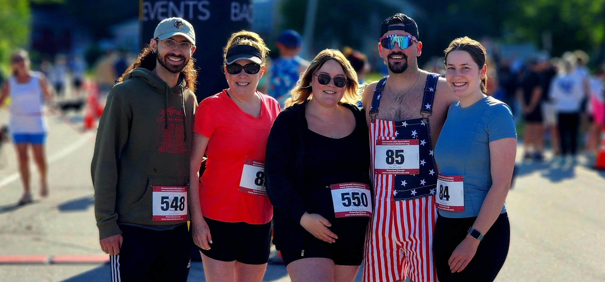 Five people smiling at the camera