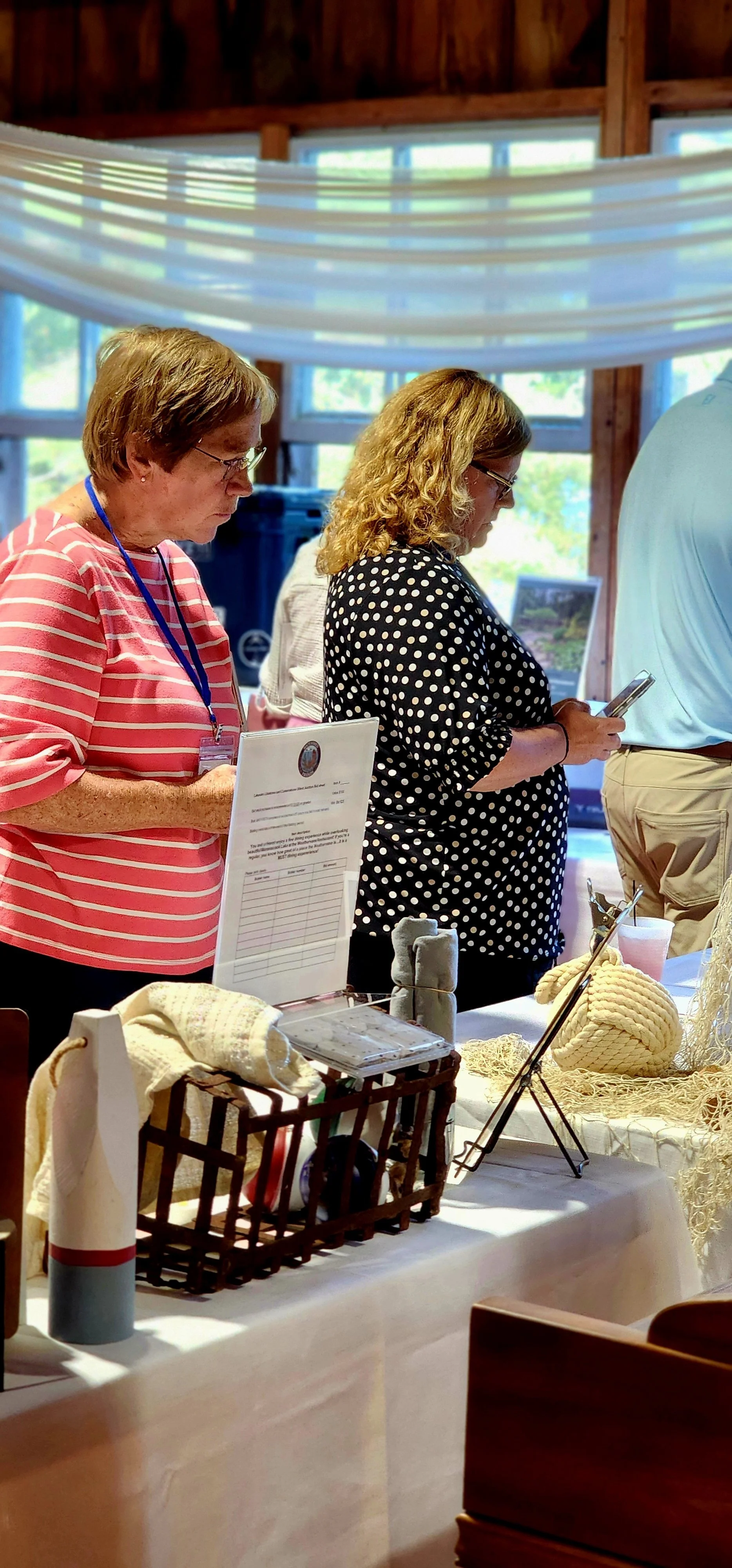 People perusing the silent auctions items