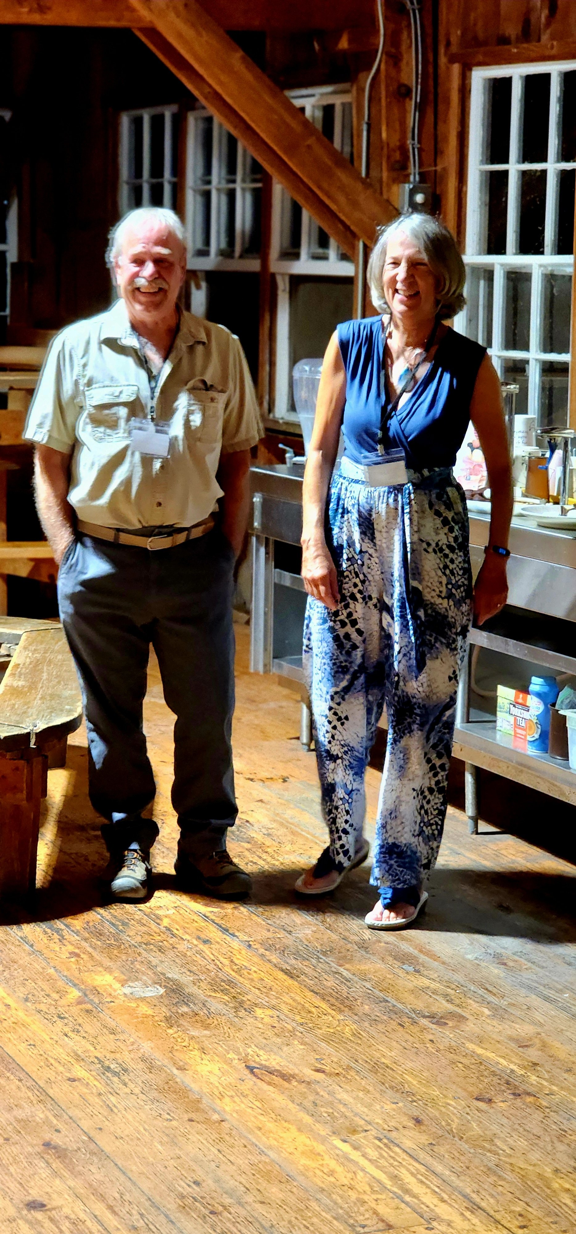 A man and a woman smiling at the camera