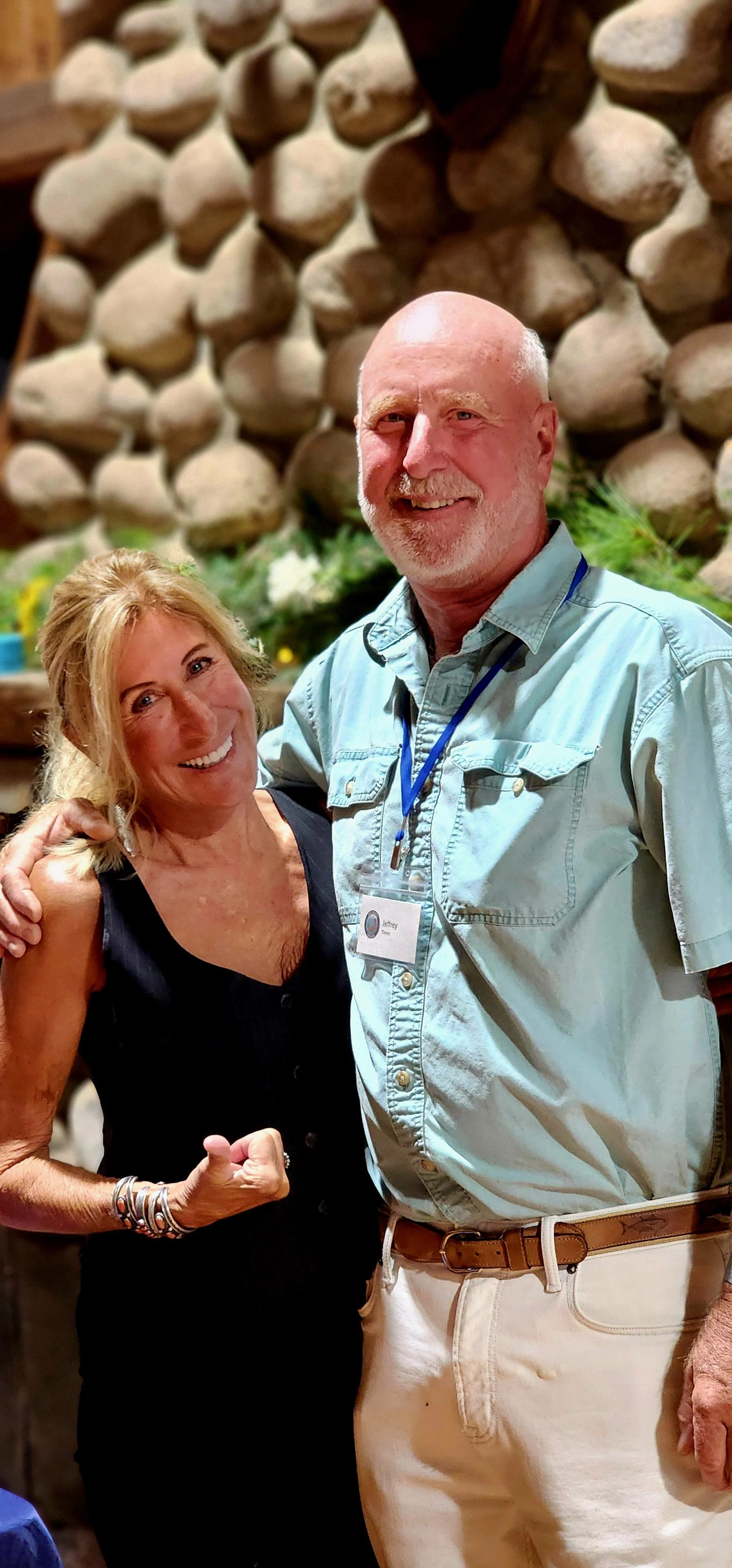 A woman and a man smiling at the camera