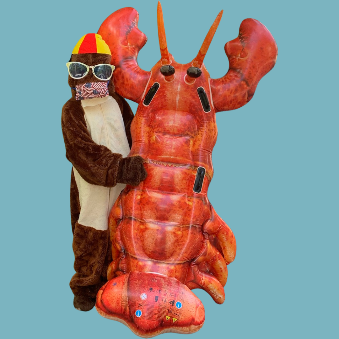 Spotter (otter mascot) holding a human sized inflatable lobster