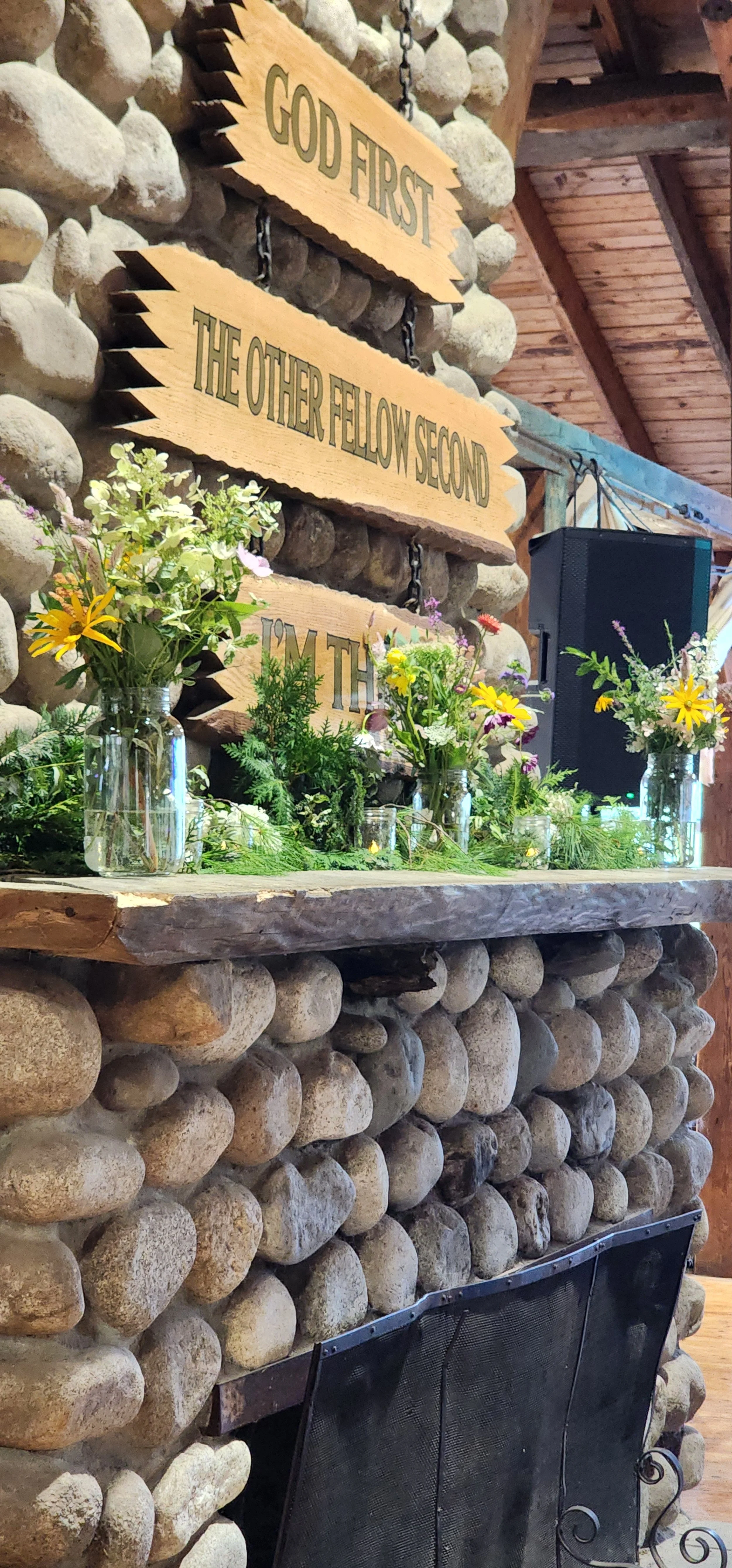 Fireplace mantle with greenery on it