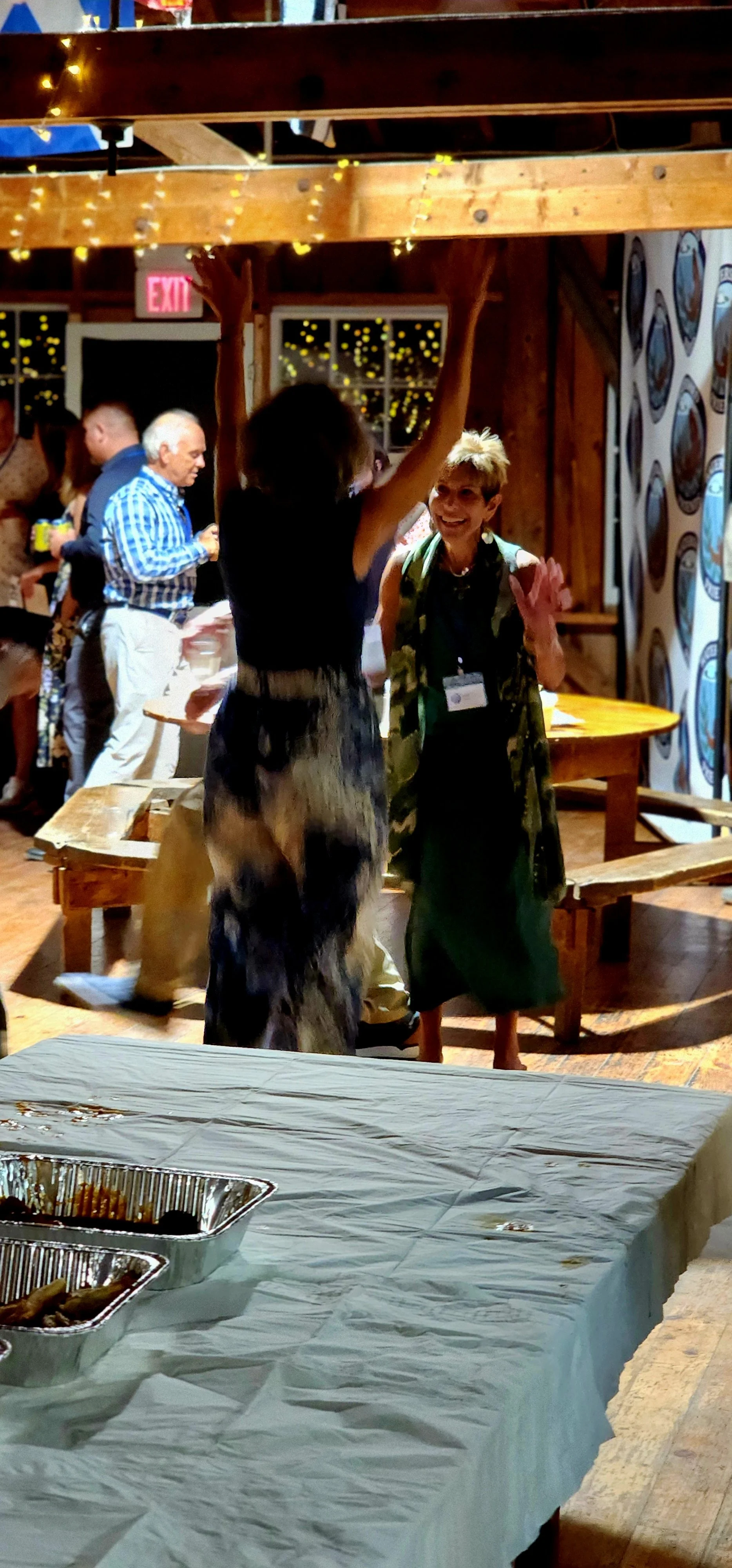 A distance shot of two women dancing