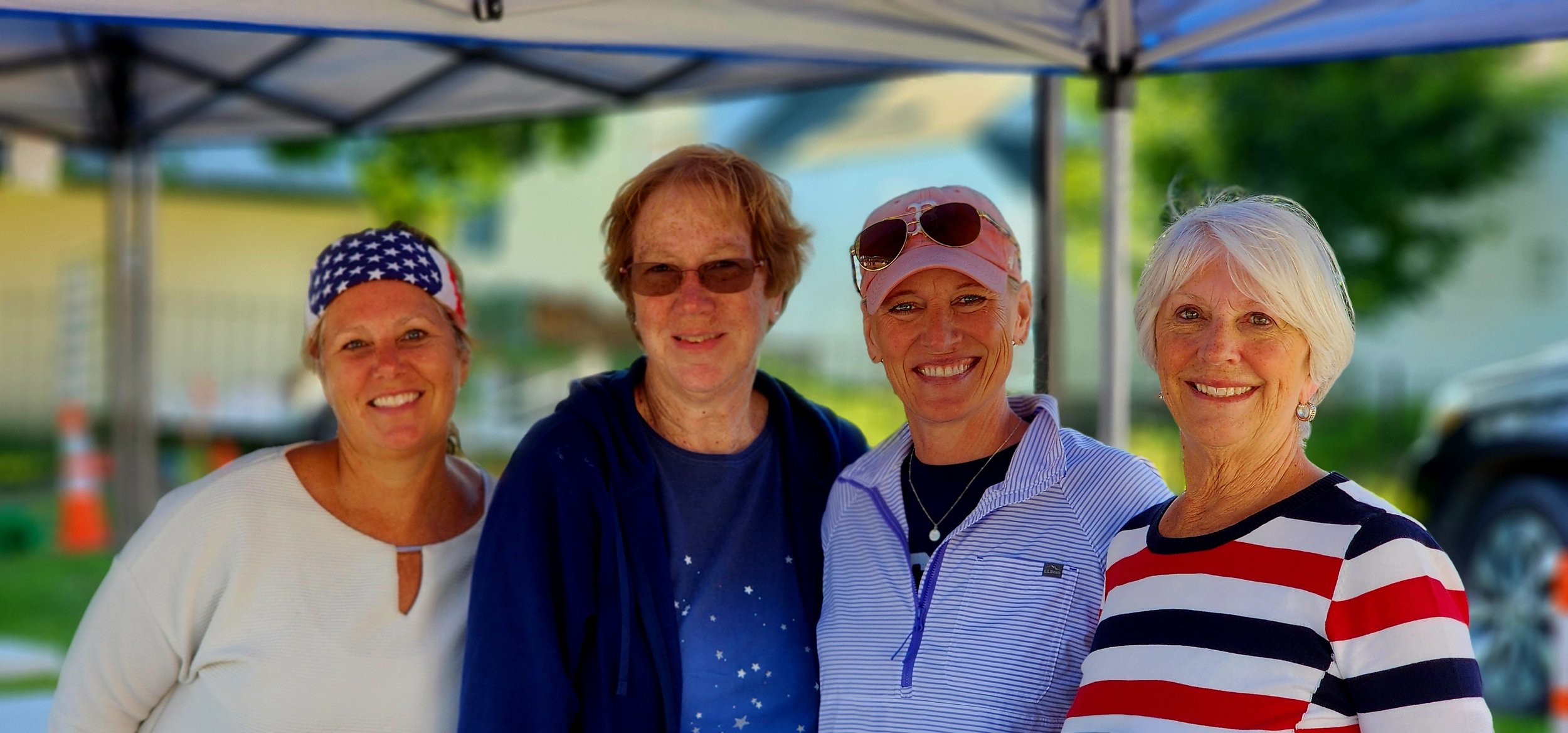 Four women smiling at the camera