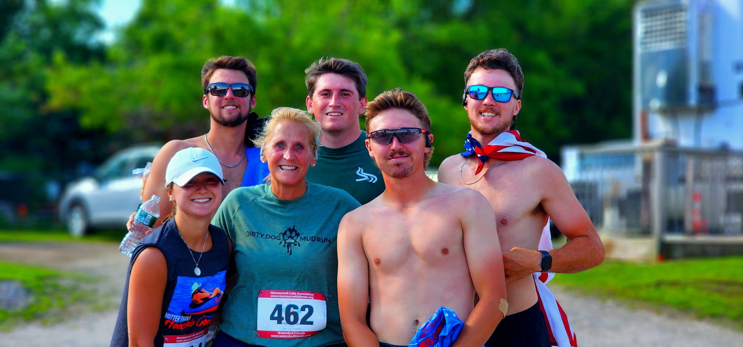 A group of six people smiling at the camera