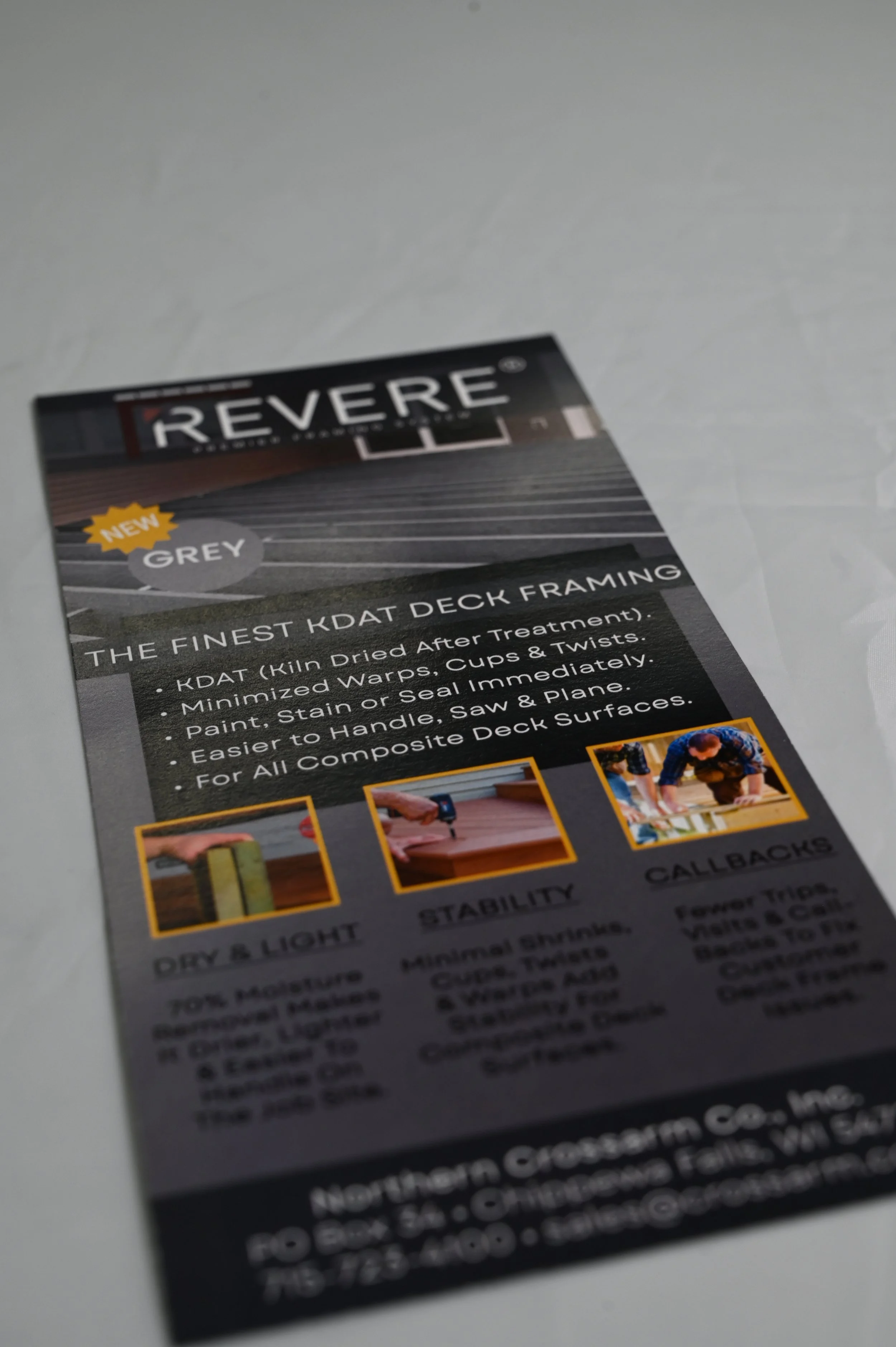 Printed marketing flyer or brochure cover on a table