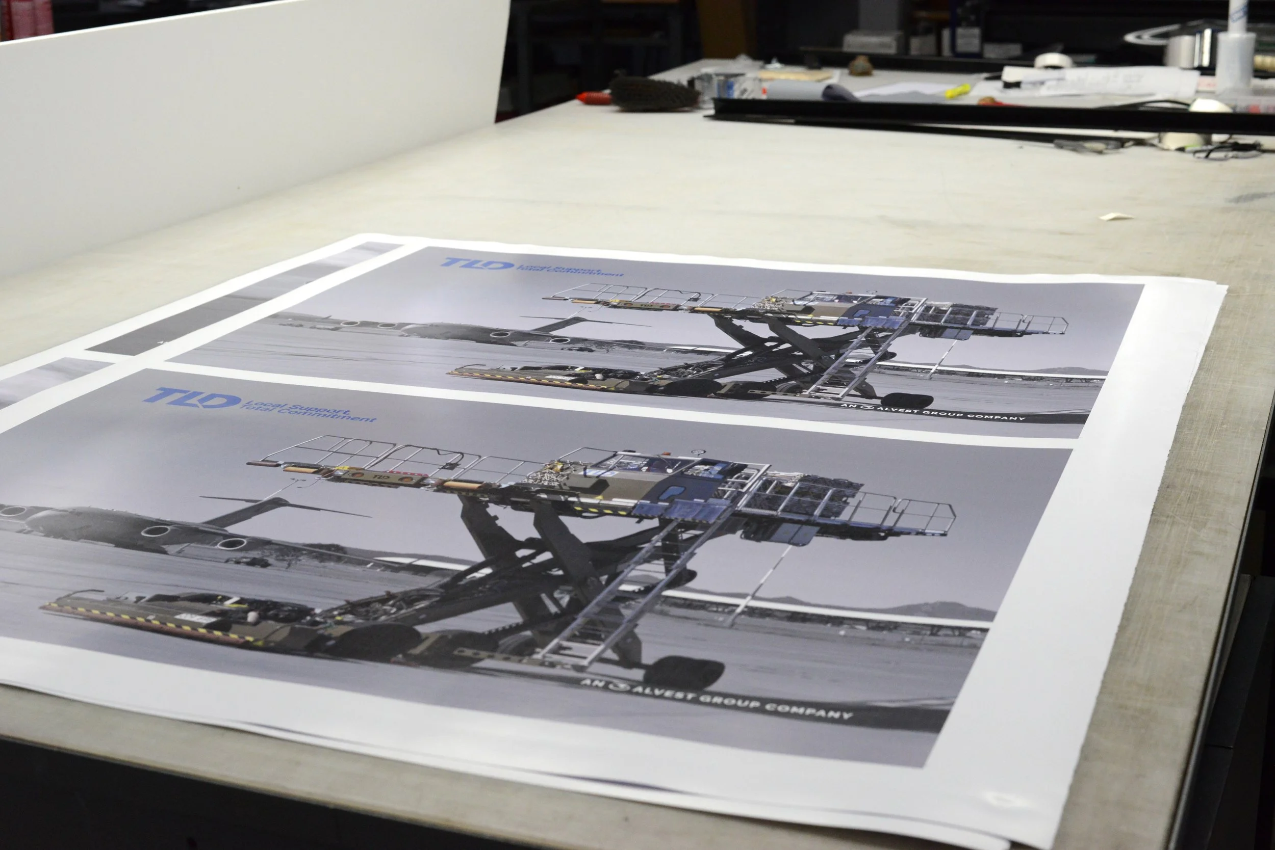 Printed event program sheets on a worktable