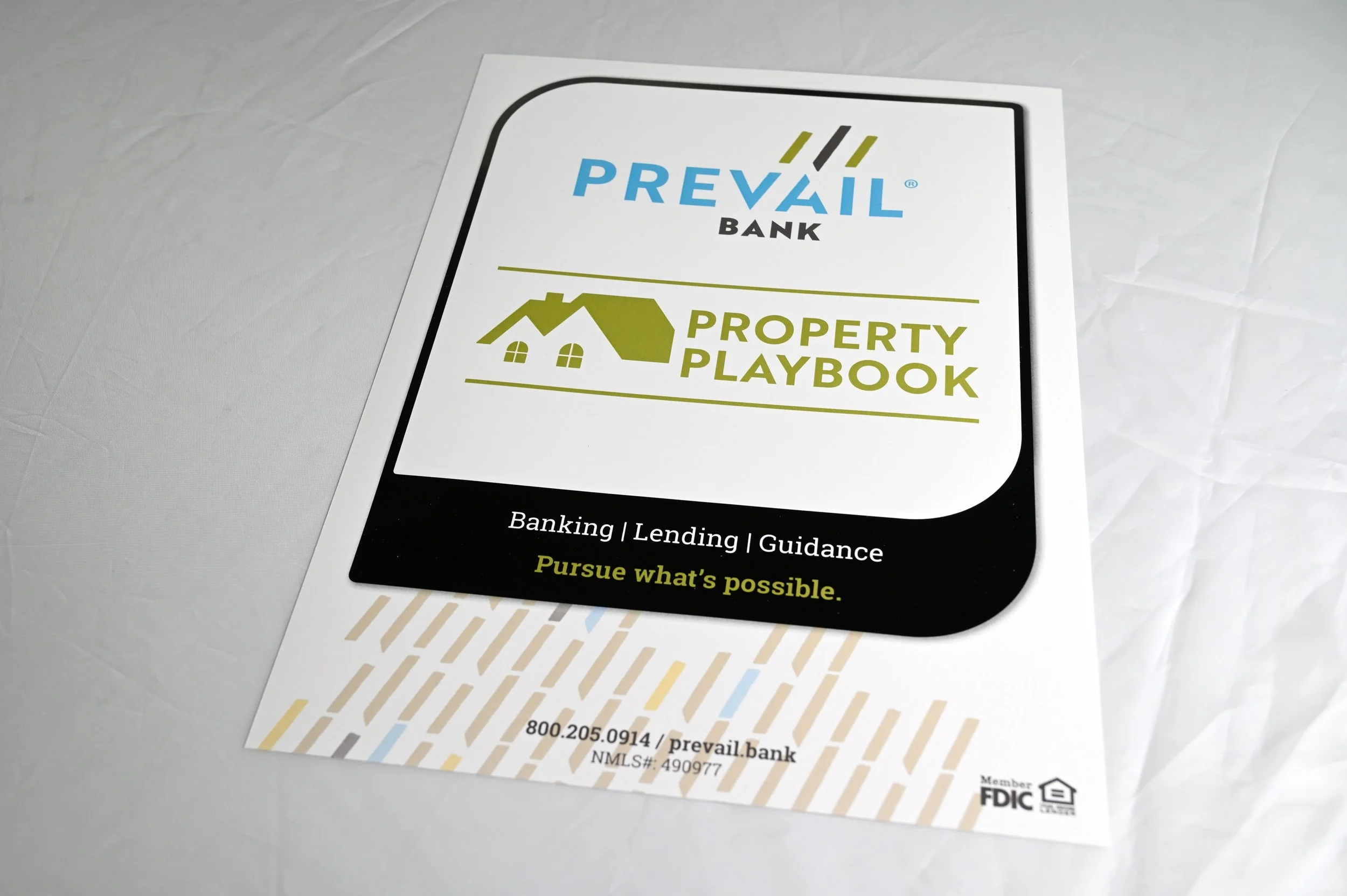 4x6 promotional handout card for Prevail Bank’s Property Playbook