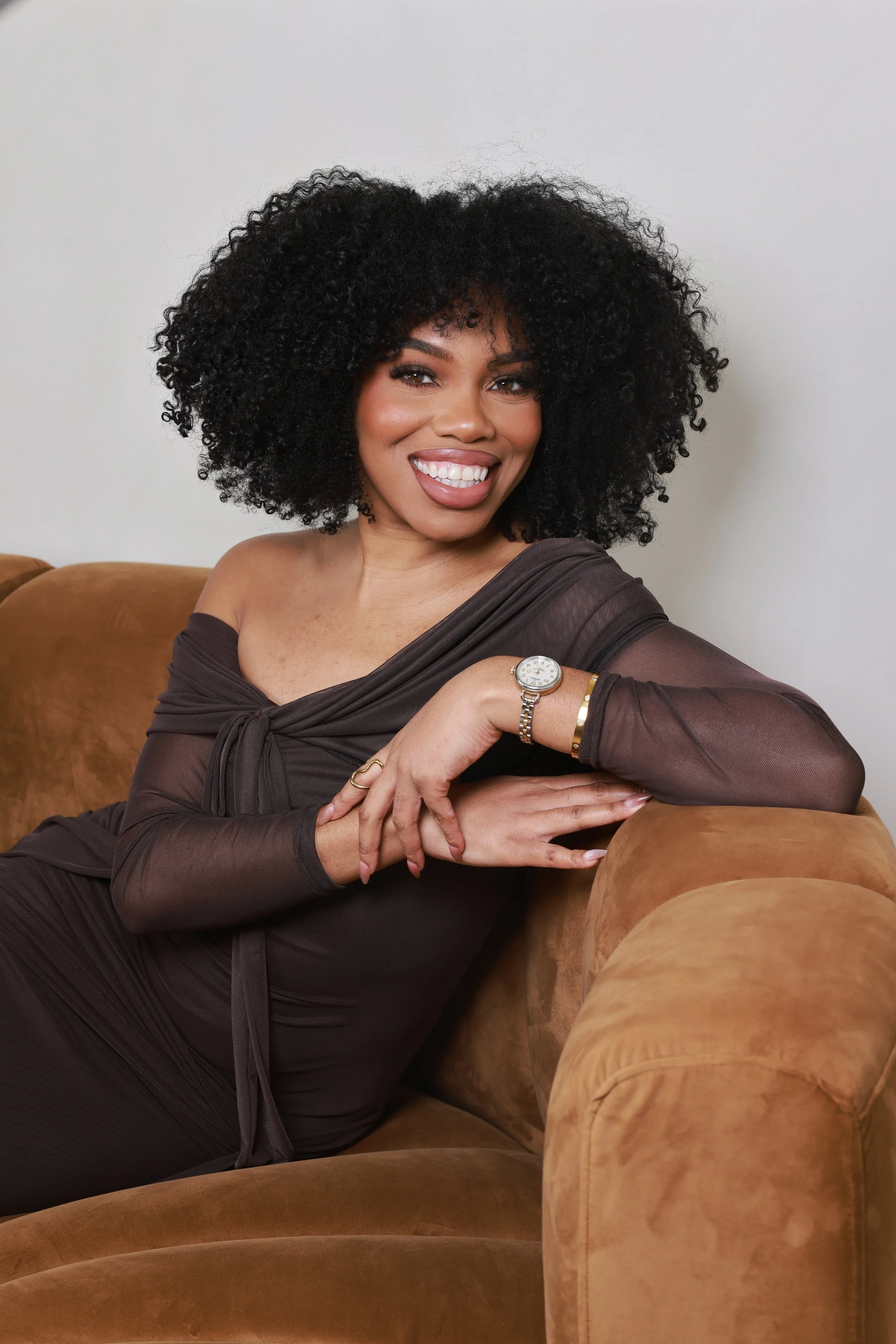 Woman with natural curls wash and go in Royal Oak hair salon