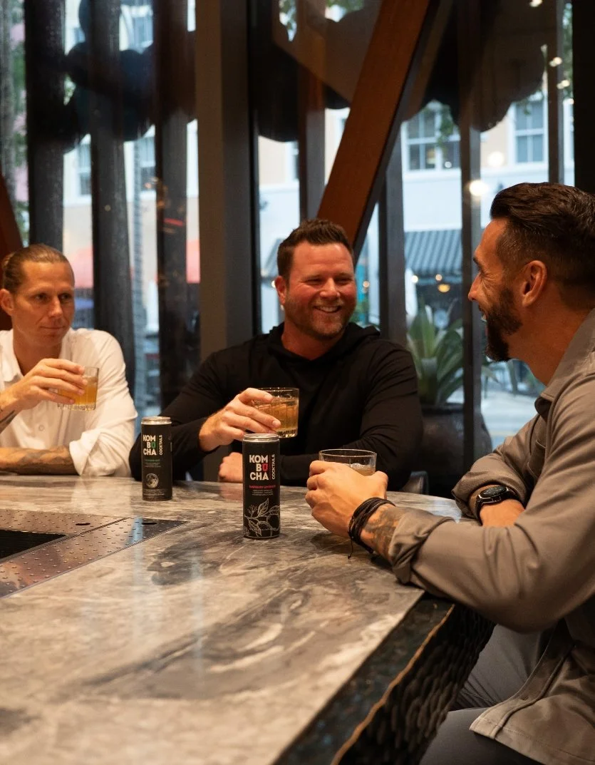 Fluid Consulting teams shares a cocktail.