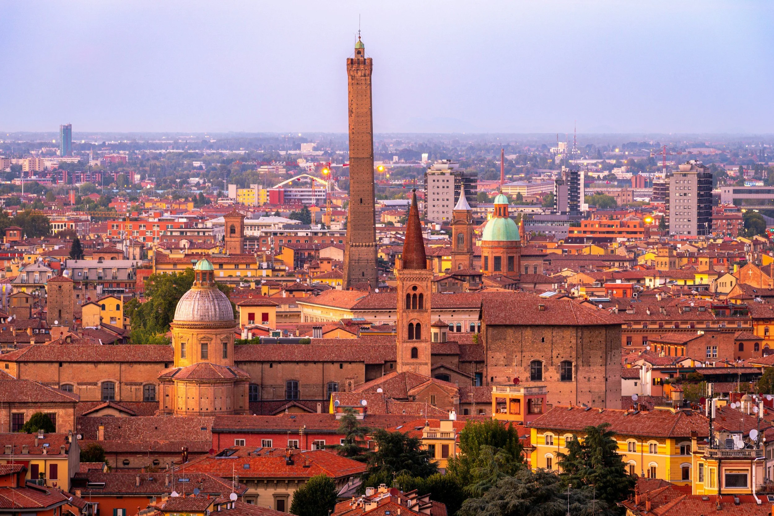 Bologna | 
Renowned for its food scene, try a traditional aperitivo and local specialties like (Rob's favourite) mortadella and tagliatelle al ragù. Just 1 hour by train.