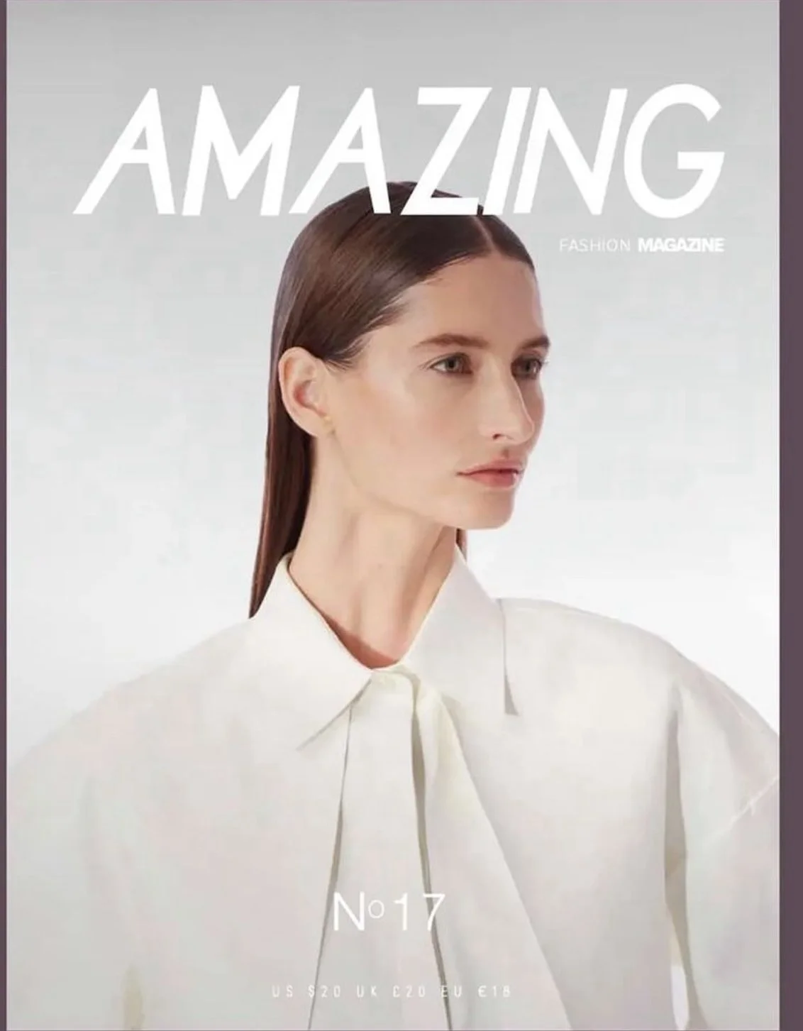 Front cover of 'Amazing' fashion magazine featuring a woman with long brown hair in a white blouse with a bow tied at the collar, looking to the right against a pale background.