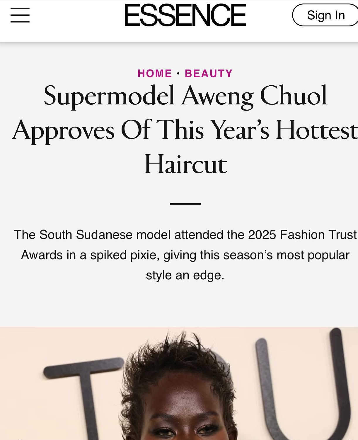 Screenshot of a webpage from ESSENCE featuring a model with a spiked hairstyle, attending the 2025 Fashion Trust Awards.