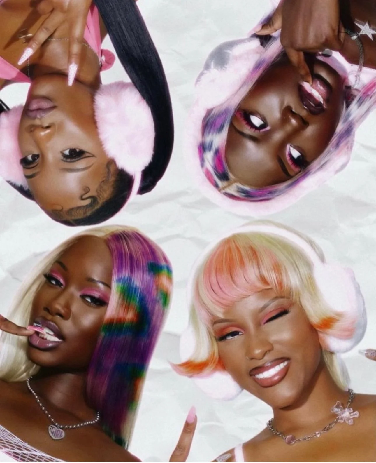 Four women with colorful hairstyles and makeup, each making playful facial expressions and gestures.